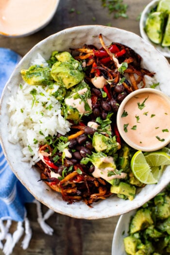 These Chipotle Oyster Mushroom Bowls are like fajitas with the addition of crispy mushrooms. Topped with avocado & dairy-free chipotle mayo | ThisSavoryVegan.com