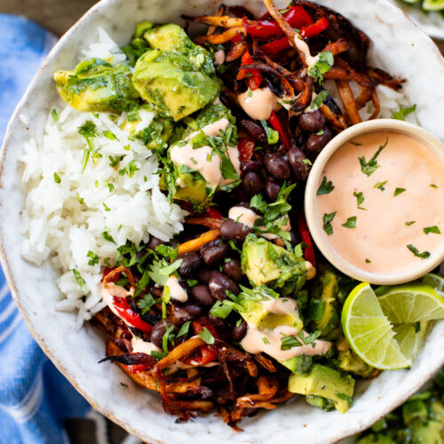 These Chipotle Oyster Mushroom Bowls are like fajitas with the addition of crispy mushrooms. Topped with avocado & dairy-free chipotle mayo | ThisSavoryVegan.com