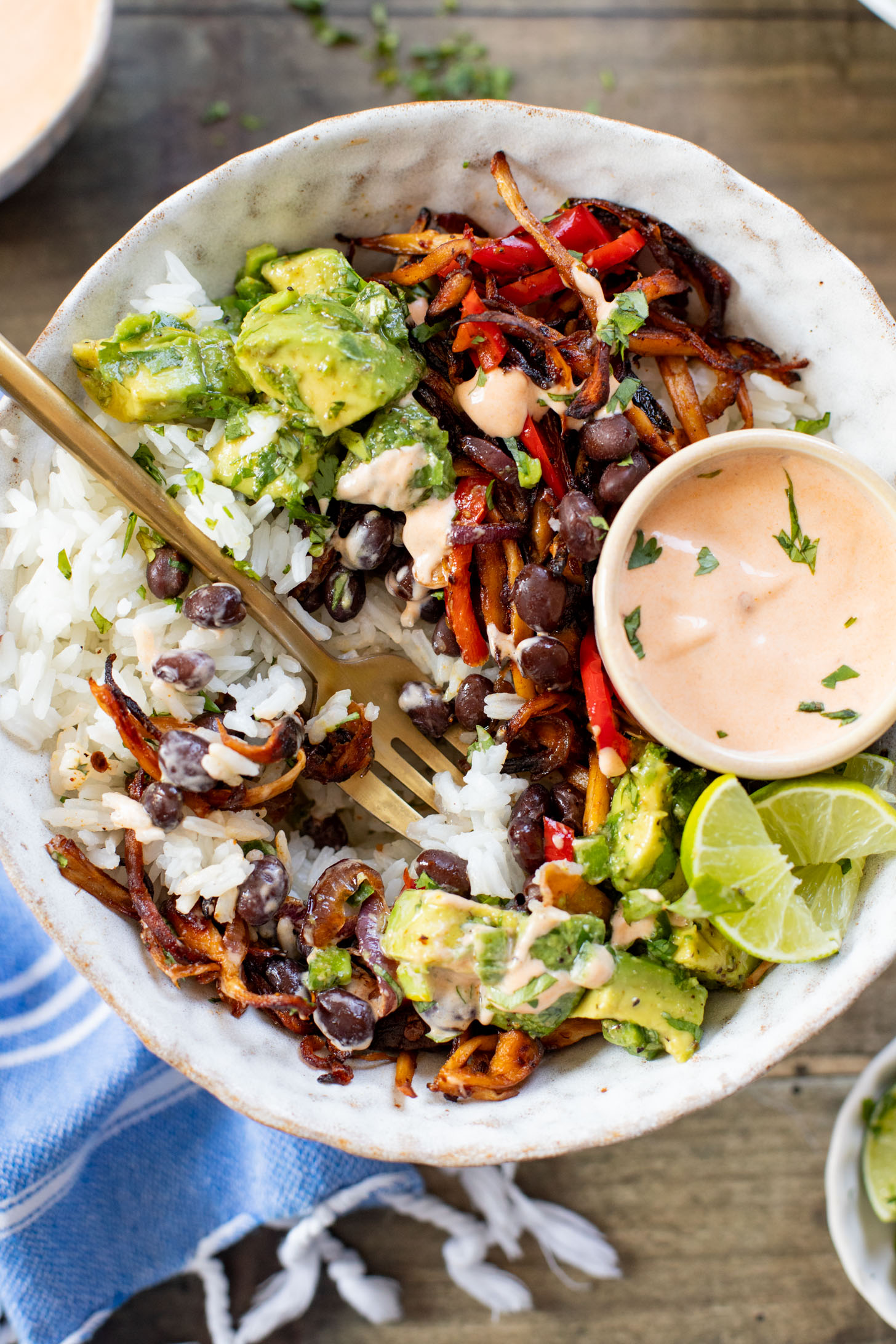 These Chipotle Oyster Mushroom Bowls are like fajitas with the addition of crispy mushrooms. Topped with avocado & dairy-free chipotle mayo | ThisSavoryVegan.com