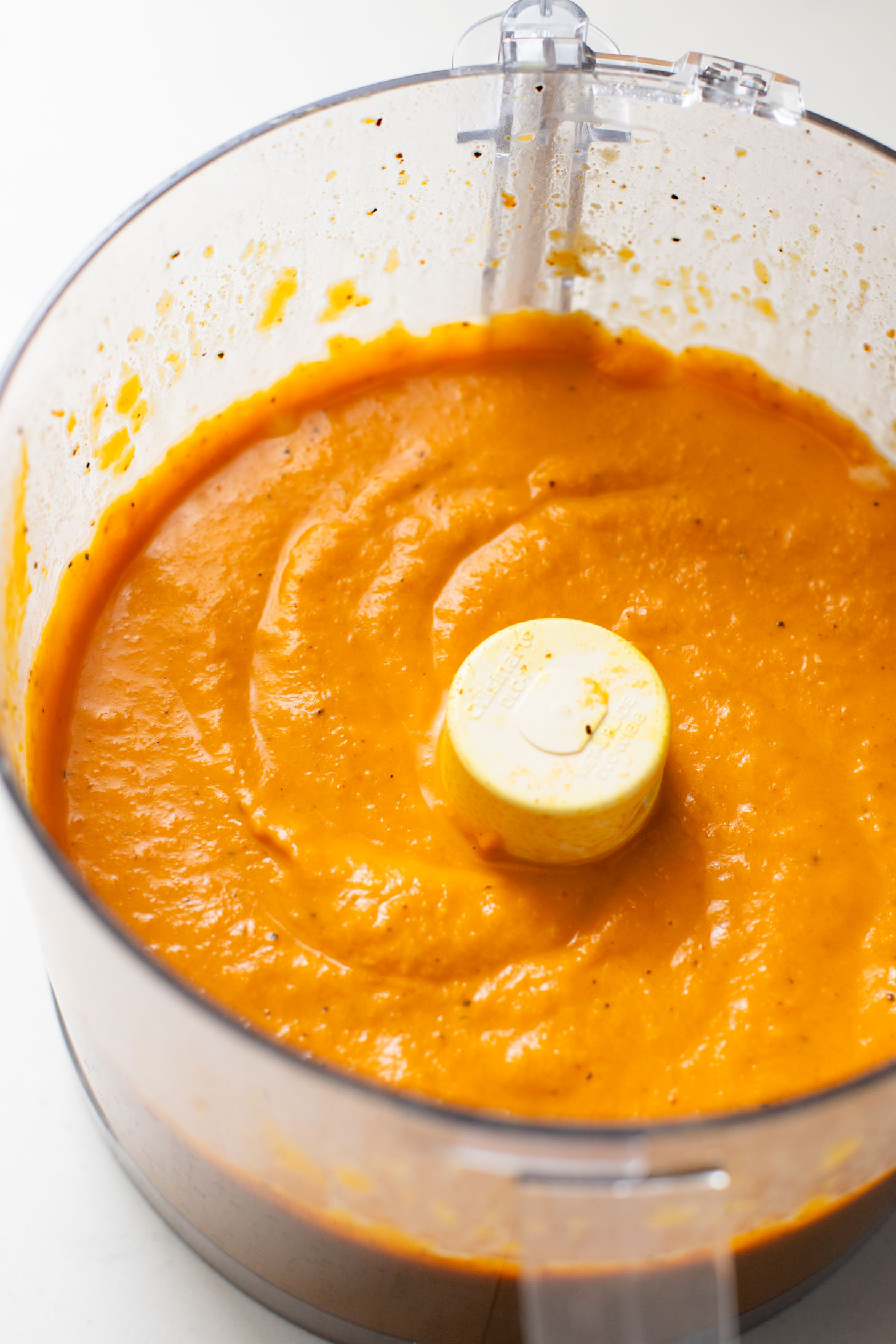 This Curried White Beans & Kale recipe is cozy and veggie packed! Beans are simmered in a coconut & squash sauce to make a delicious vegan curry | ThisSavoryVegan.com