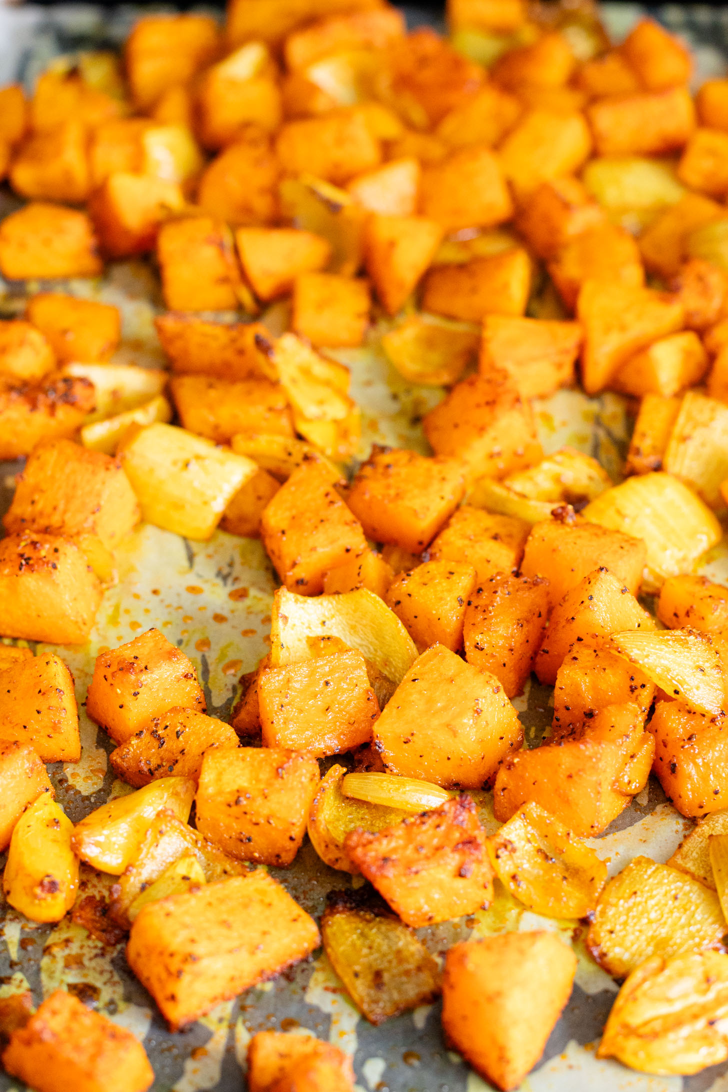 This Curried White Beans & Kale recipe is cozy and veggie packed! Beans are simmered in a coconut & squash sauce to make a delicious vegan curry | ThisSavoryVegan.com