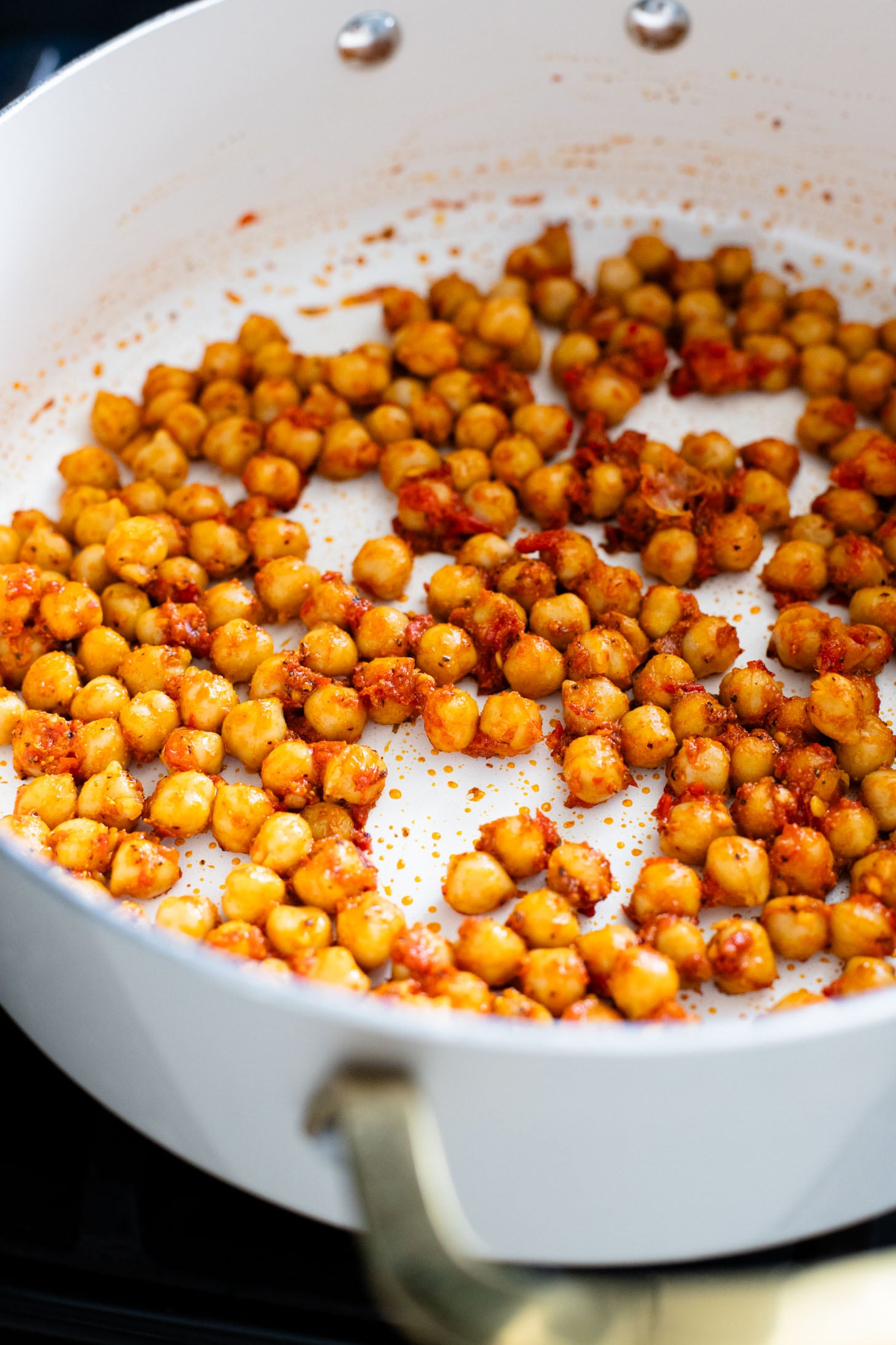 This Harissa Chickpeas & Asparagus recipe is the best skillet dinner. Made with simple vegan ingredients and served over rice for a tasty meal | ThisSavoryVegan.com
