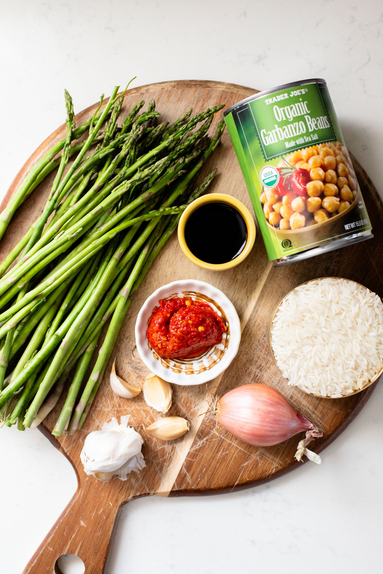 This Harissa Chickpeas & Asparagus recipe is the best skillet dinner. Made with simple vegan ingredients and served over rice for a tasty meal | ThisSavoryVegan.com