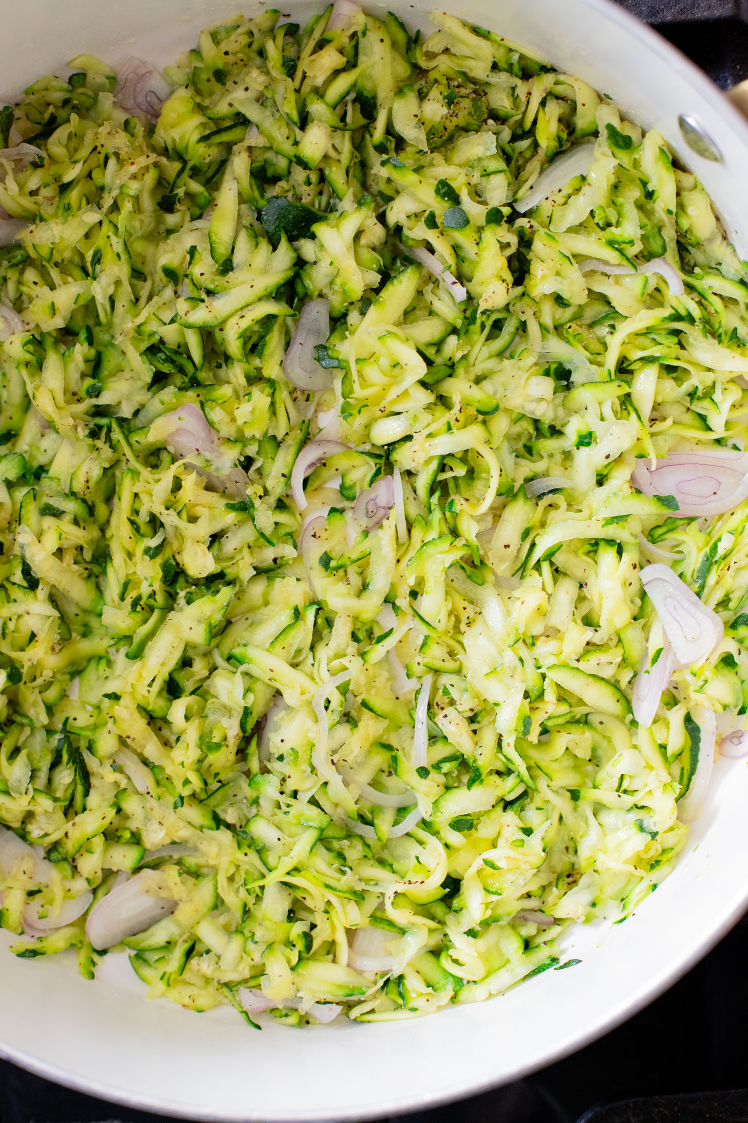 This Lemon Zucchini Bucatini is a simple vegan pasta dish that is creamy, loaded with veggies & 100% dairy-free | ThisSavoryVegan.com