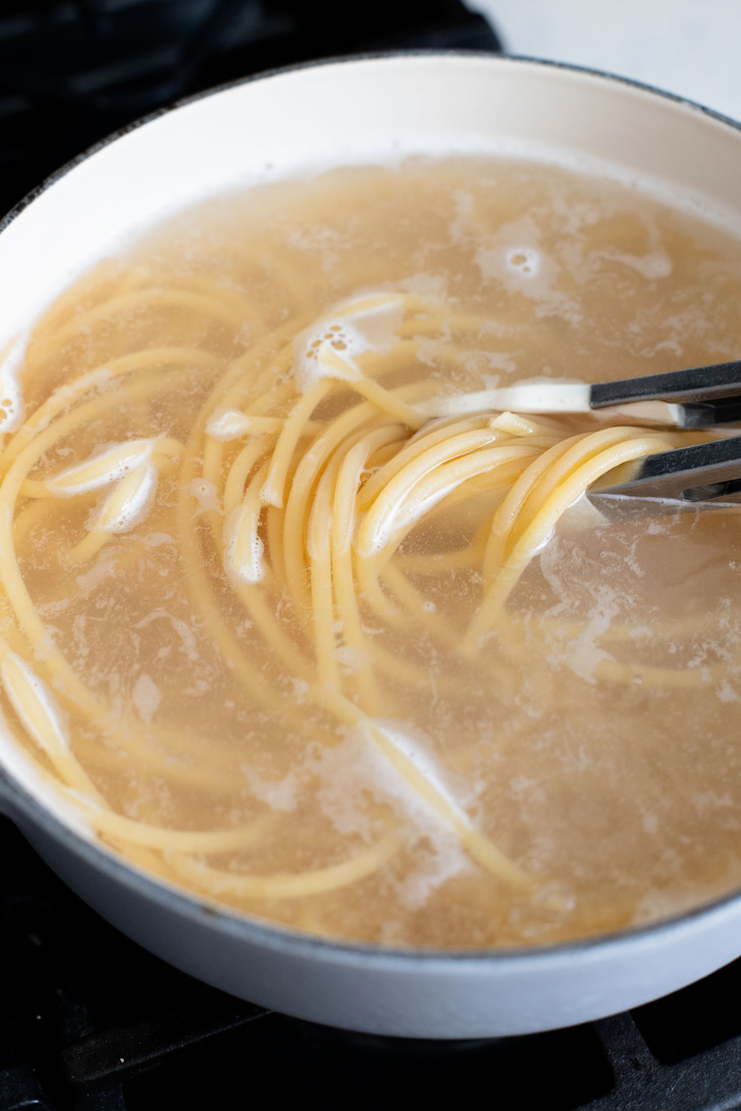 This Lemon Zucchini Bucatini is a simple vegan pasta dish that is creamy, loaded with veggies & 100% dairy-free | ThisSavoryVegan.com