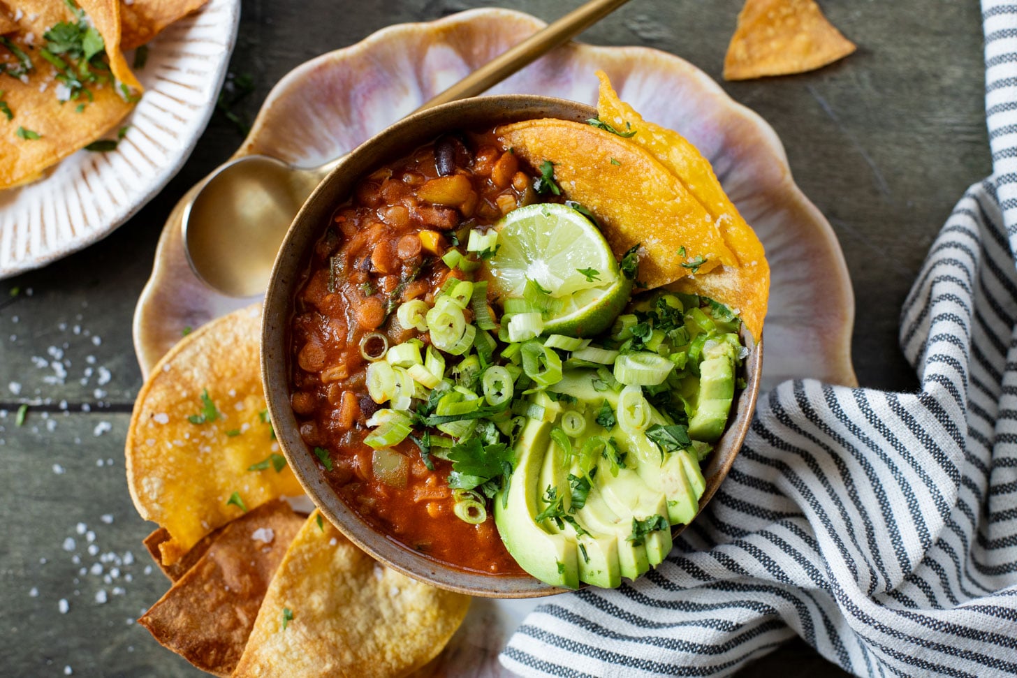 Cozy, comforting & healthy, this Lentil & Rice Enchilada Chili is the perfect one-pot vegan dinner! Perfect for meal prepped lunches | ThisSavoryVegan.com