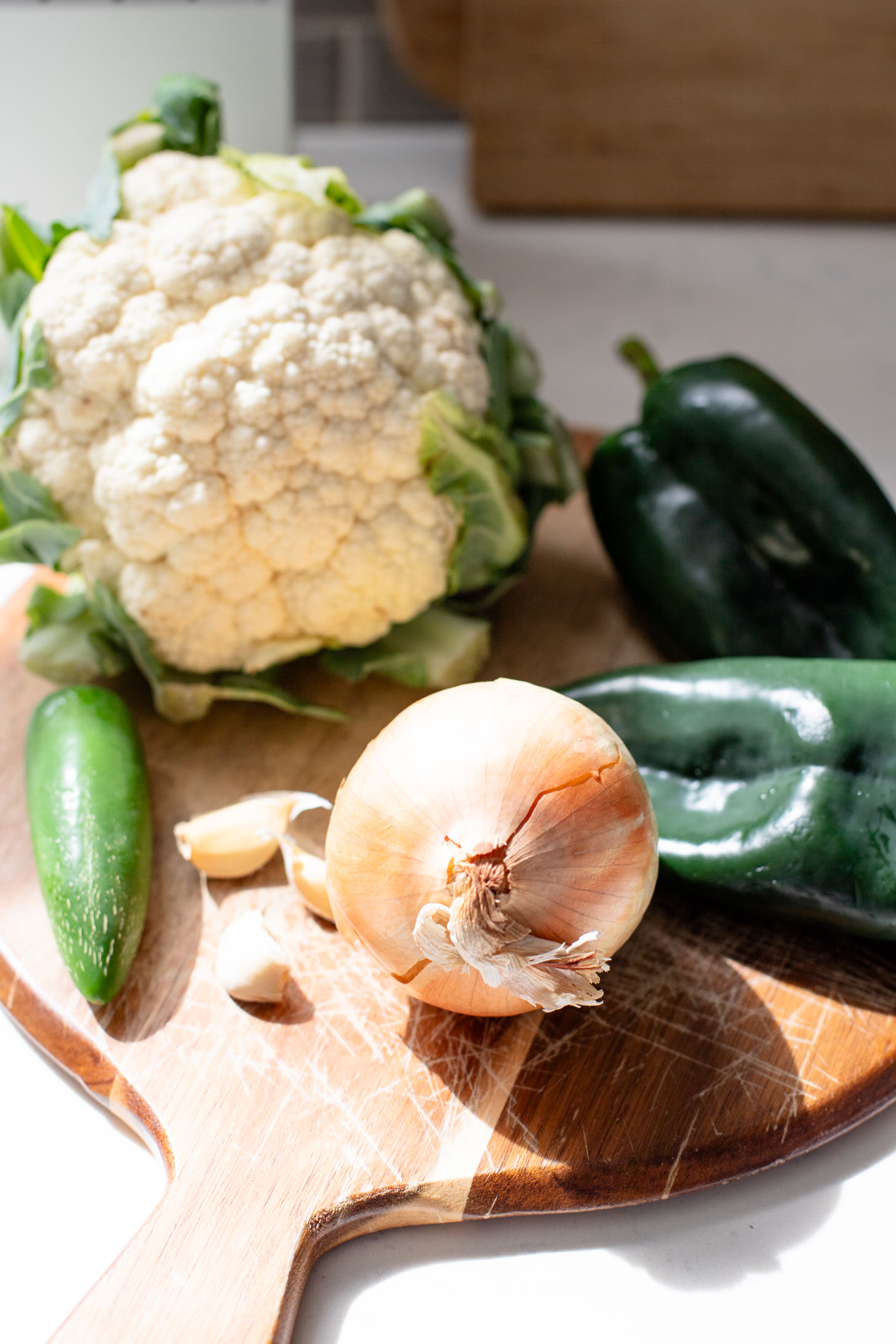 This Roasted Cauliflower in Poblano Sauce is a complete vegan dinner. Filled with lentils, crispy cauliflower & the best poblano sauce | ThisSavoryVegan.com