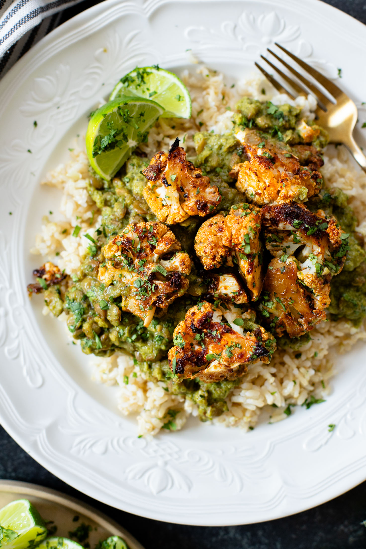 This Roasted Cauliflower in Poblano Sauce is a complete vegan dinner. Filled with lentils, crispy cauliflower & the best poblano sauce | ThisSavoryVegan.com