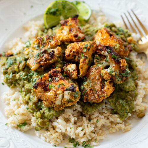 This Roasted Cauliflower in Poblano Sauce is a complete vegan dinner. Filled with lentils, crispy cauliflower & the best poblano sauce | ThisSavoryVegan.com