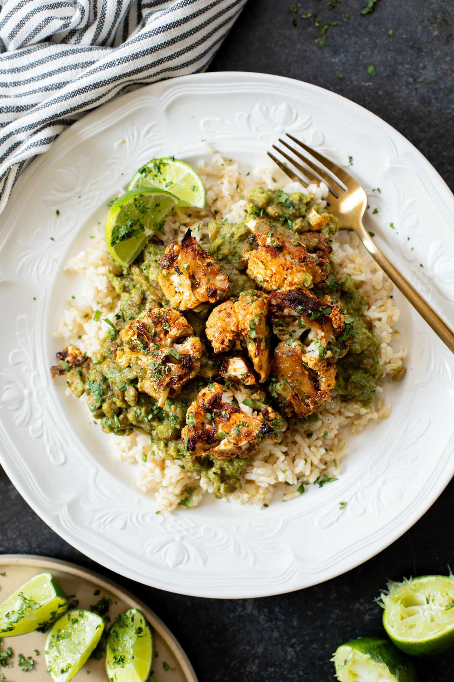 This Roasted Cauliflower in Poblano Sauce is a complete vegan dinner. Filled with lentils, crispy cauliflower & the best poblano sauce | ThisSavoryVegan.com