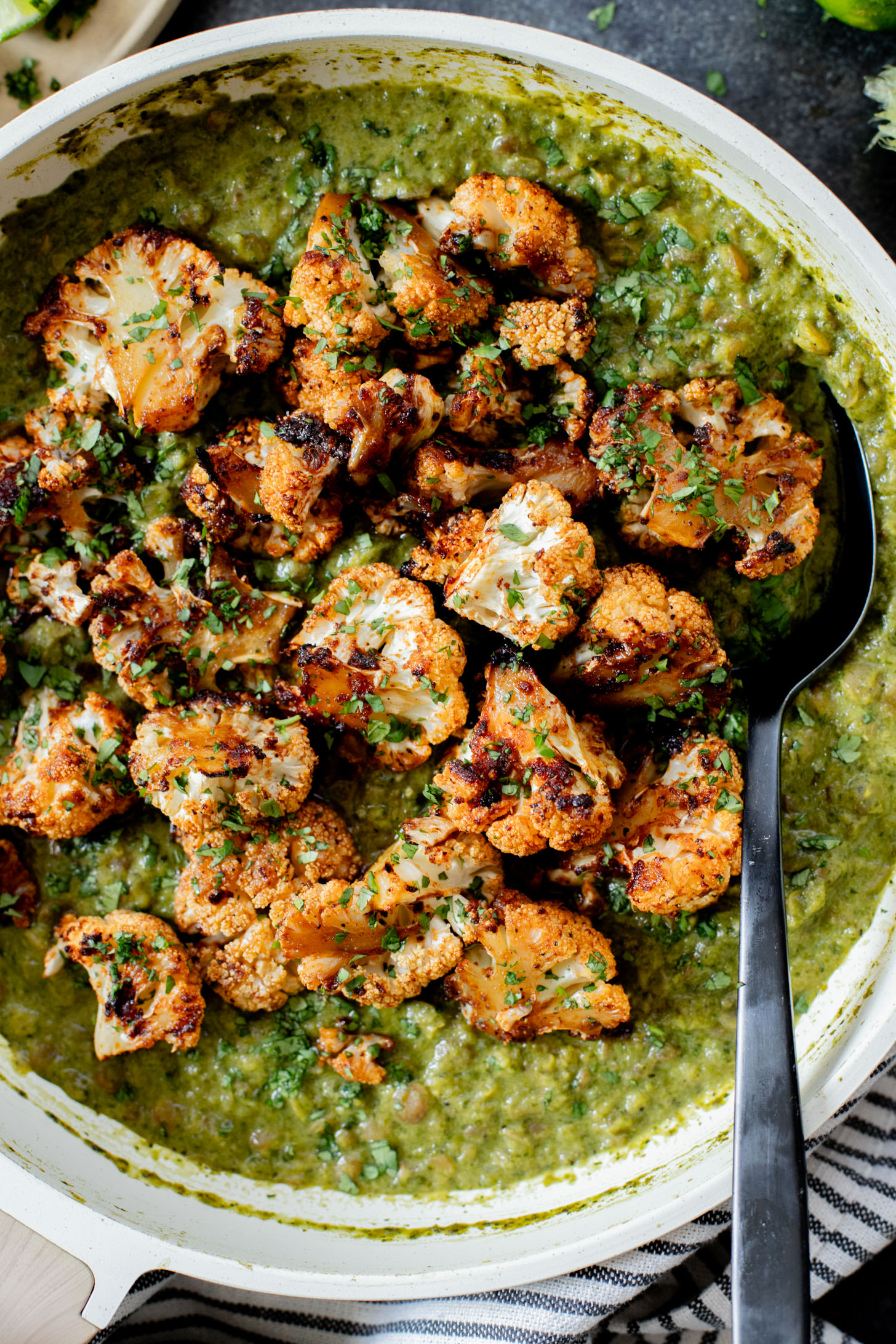 This Roasted Cauliflower in Poblano Sauce is a complete vegan dinner. Filled with lentils, crispy cauliflower & the best poblano sauce | ThisSavoryVegan.com