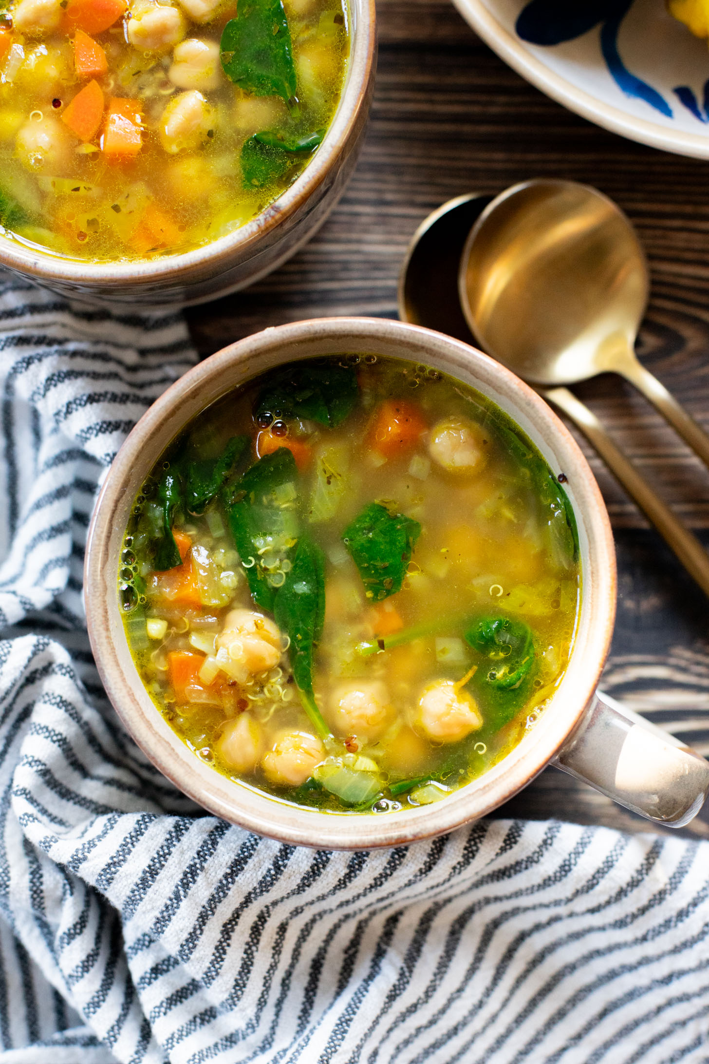 This Chickpea & Quinoa Lemon Soup is a healthy, light and tasty vegan soup recipe. Filled with veggies, chickpeas, quinoa & delicious broth | ThisSavoryVegan.com