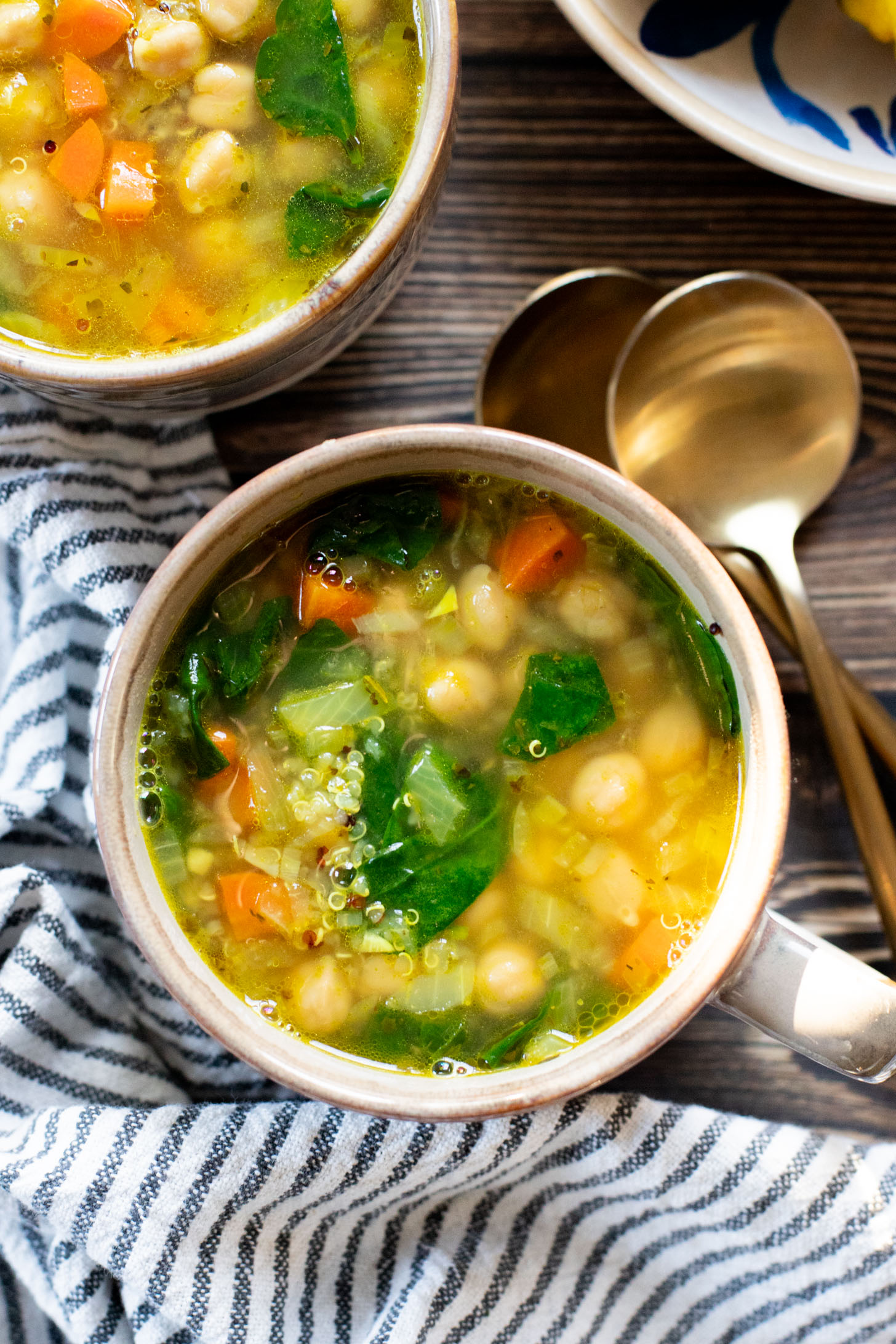 This Chickpea & Quinoa Lemon Soup is a healthy, light and tasty vegan soup recipe. Filled with veggies, chickpeas, quinoa & delicious broth | ThisSavoryVegan.com
