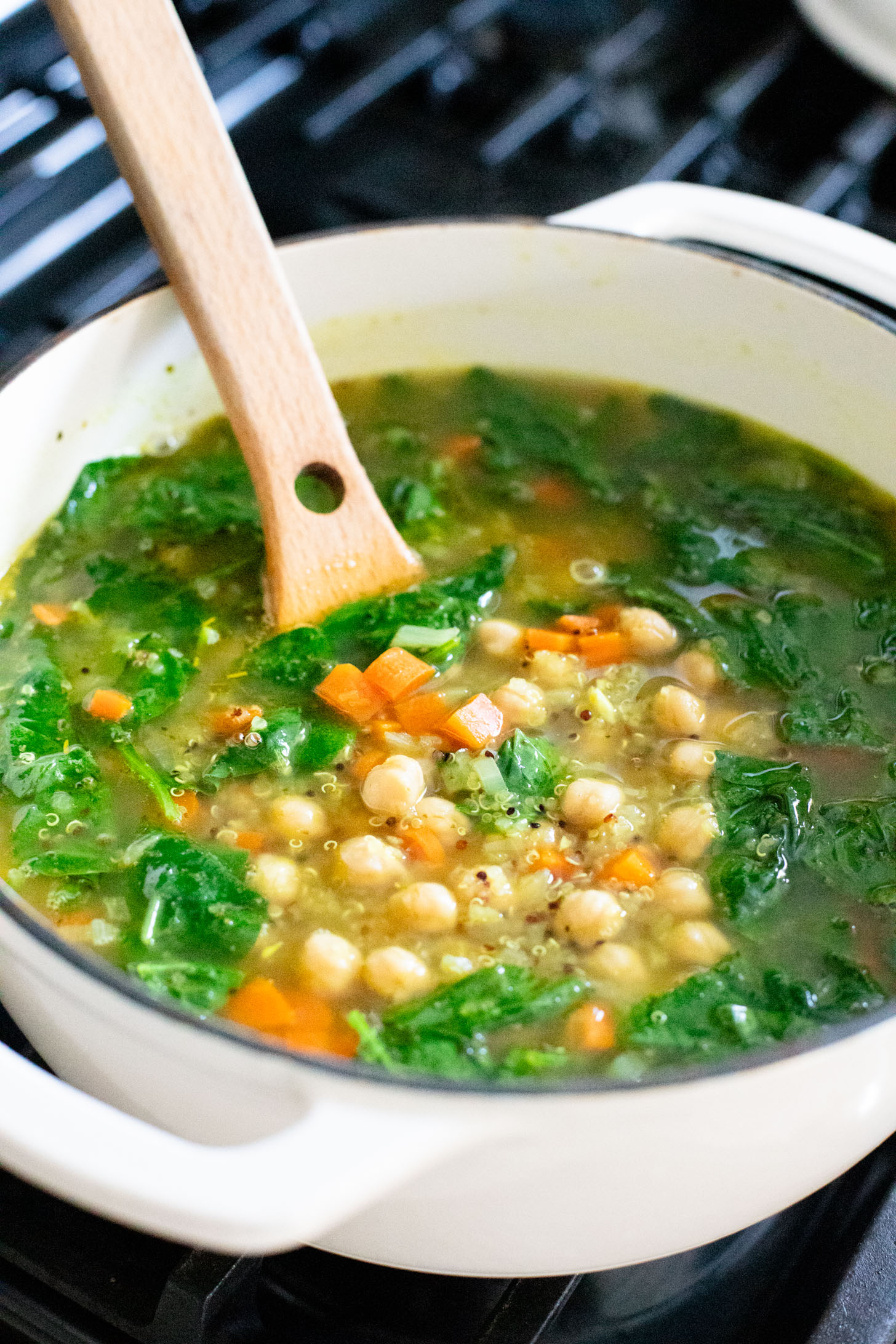 This Chickpea & Quinoa Lemon Soup is a healthy, light and tasty vegan soup recipe. Filled with veggies, chickpeas, quinoa & delicious broth | ThisSavoryVegan.com