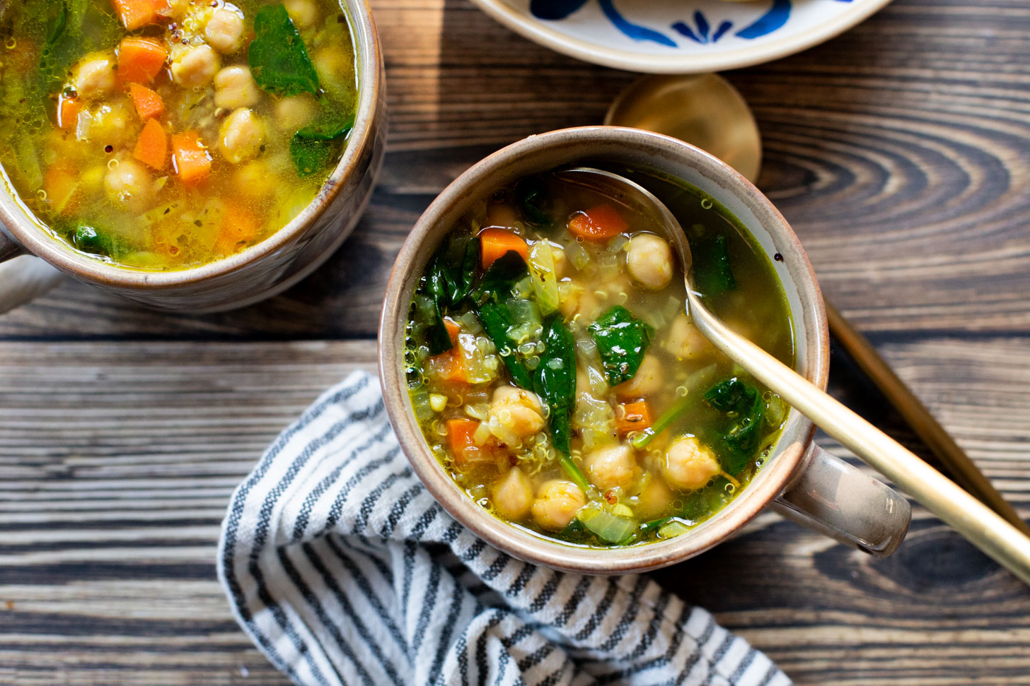 This Chickpea & Quinoa Lemon Soup is a healthy, light and tasty vegan soup recipe. Filled with veggies, chickpeas, quinoa & delicious broth | ThisSavoryVegan.com