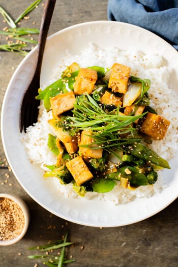 This Trader Joe's 20-Minute Tofu Stir-Fry is a simple and delicious vegan dinner idea. Made in one skillet and packed with veggies & protein | ThisSavoryVegan.com