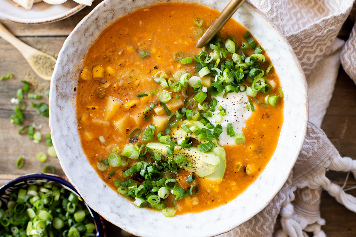 This Buffalo Potato Corn Chowder is a hearty one-pot soup that is 100% dairy-free! Serve with your favorite toppings for a cozy dinner with some spice | ThisSavoryVegan.com