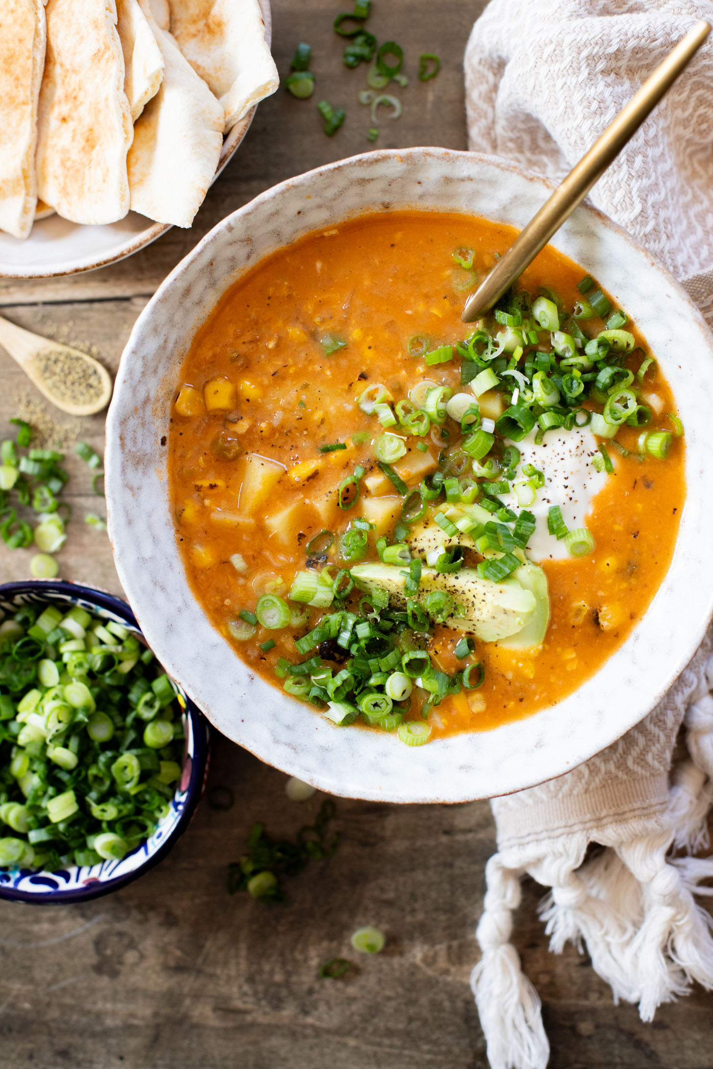 This Buffalo Potato Corn Chowder is a hearty one-pot soup that is 100% dairy-free! Serve with your favorite toppings for a cozy dinner with some spice | ThisSavoryVegan.com