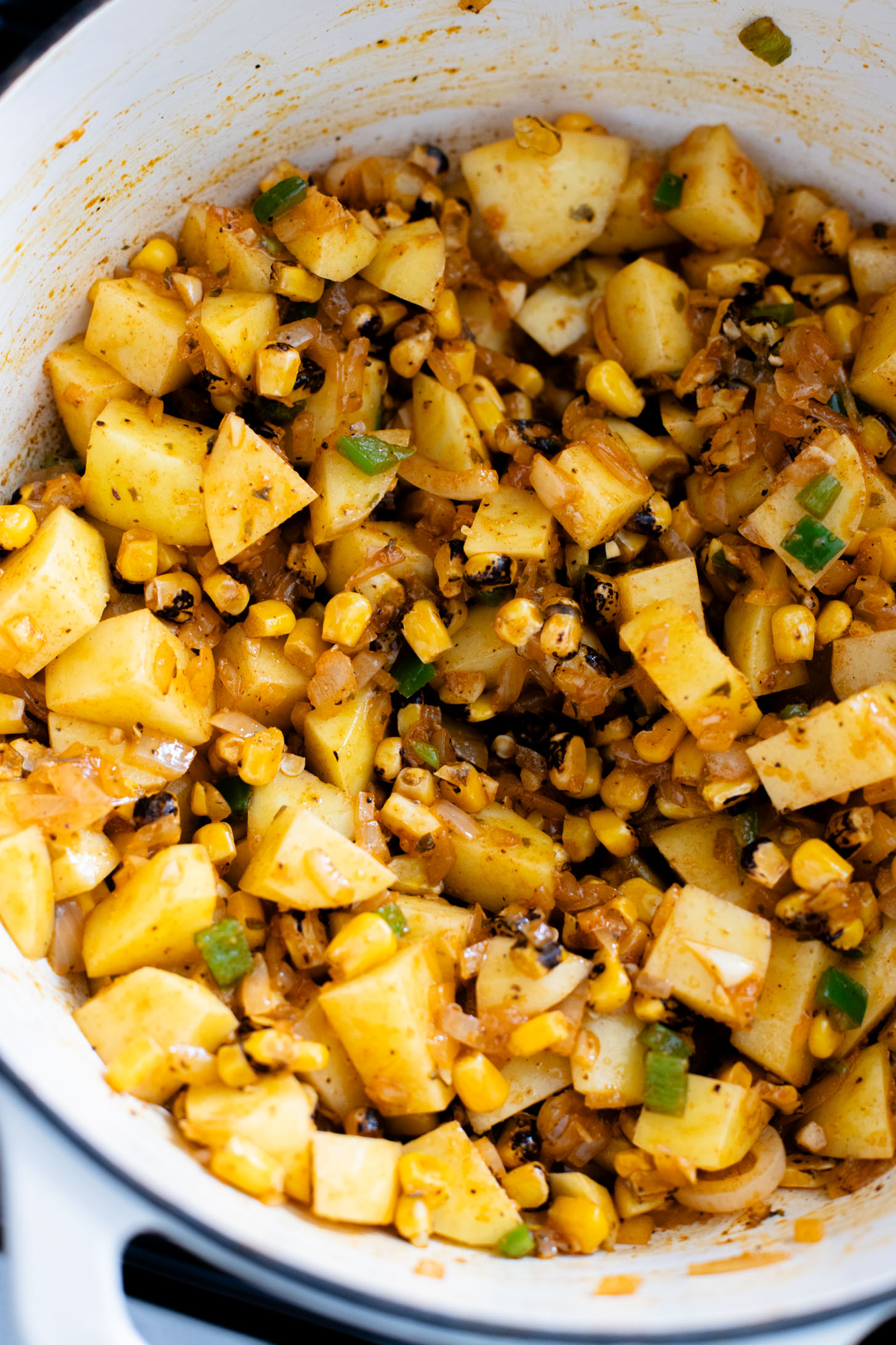 This Buffalo Potato Corn Chowder is a hearty one-pot soup that is 100% dairy-free! Serve with your favorite toppings for a cozy dinner with some spice | ThisSavoryVegan.com