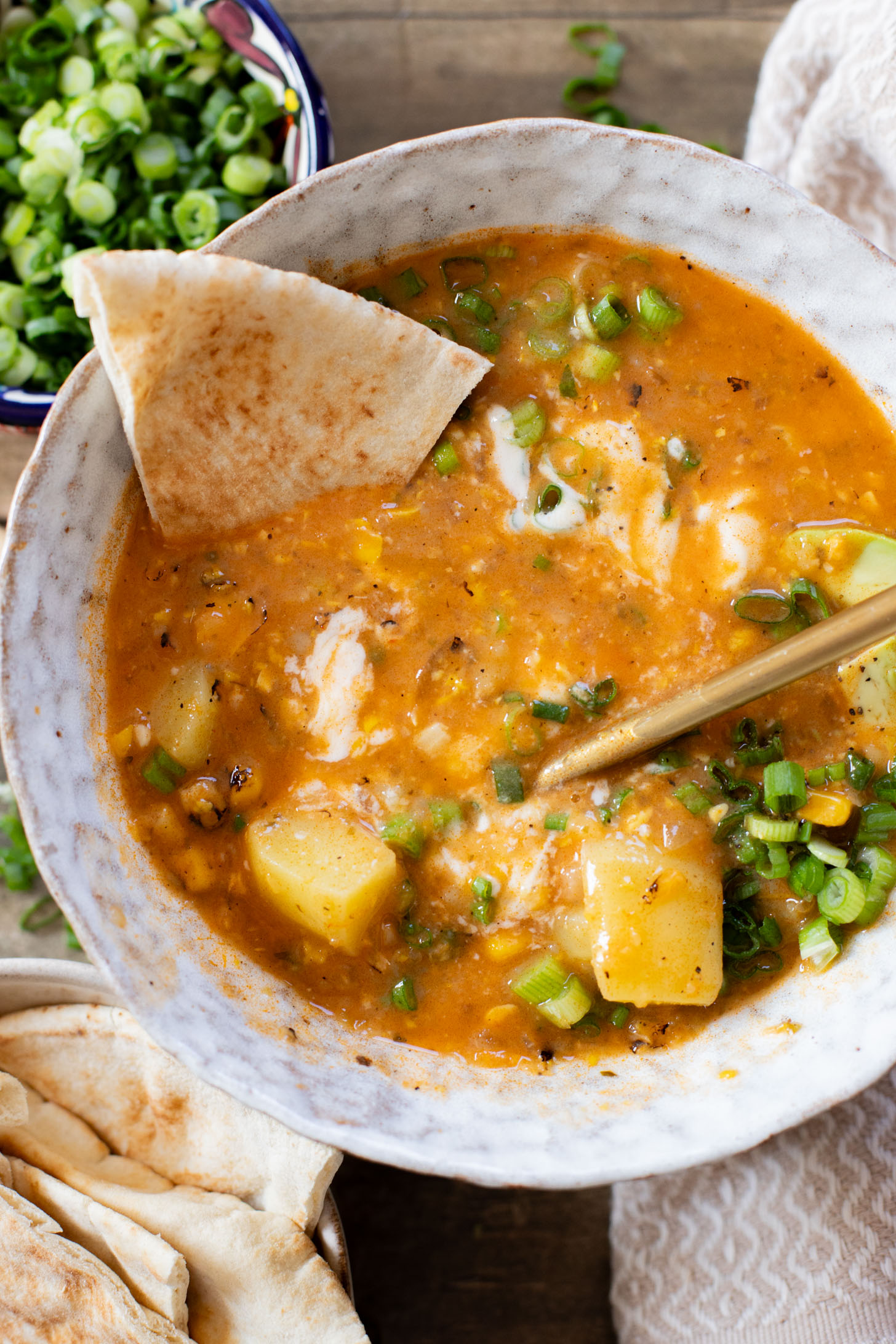 This Buffalo Potato Corn Chowder is a hearty one-pot soup that is 100% dairy-free! Serve with your favorite toppings for a cozy dinner with some spice | ThisSavoryVegan.com