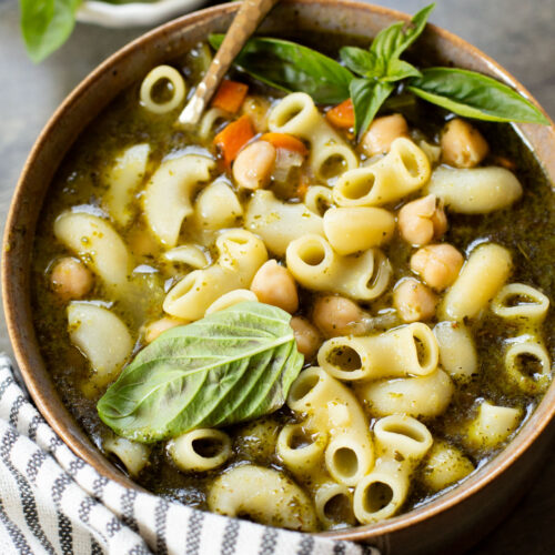 This Chickpea Pesto Macaroni Soup is a quick and tasty vegan soup recipe. A tasty broth, tender macaroni, chickpeas & veggies | ThisSavoryVegan.com