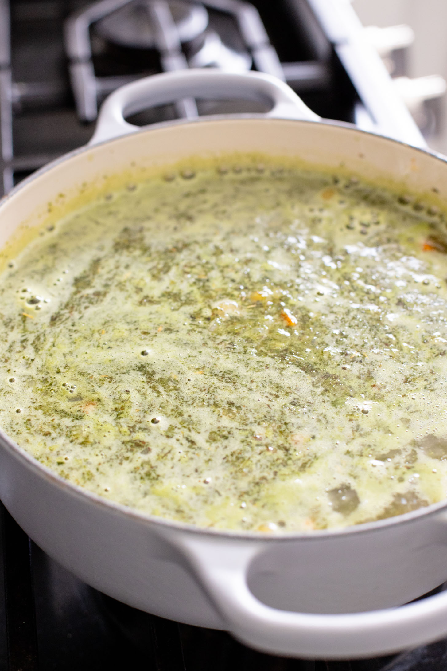 This Chickpea Pesto Macaroni Soup is a quick and tasty vegan soup recipe. A tasty broth, tender macaroni, chickpeas & veggies | ThisSavoryVegan.com