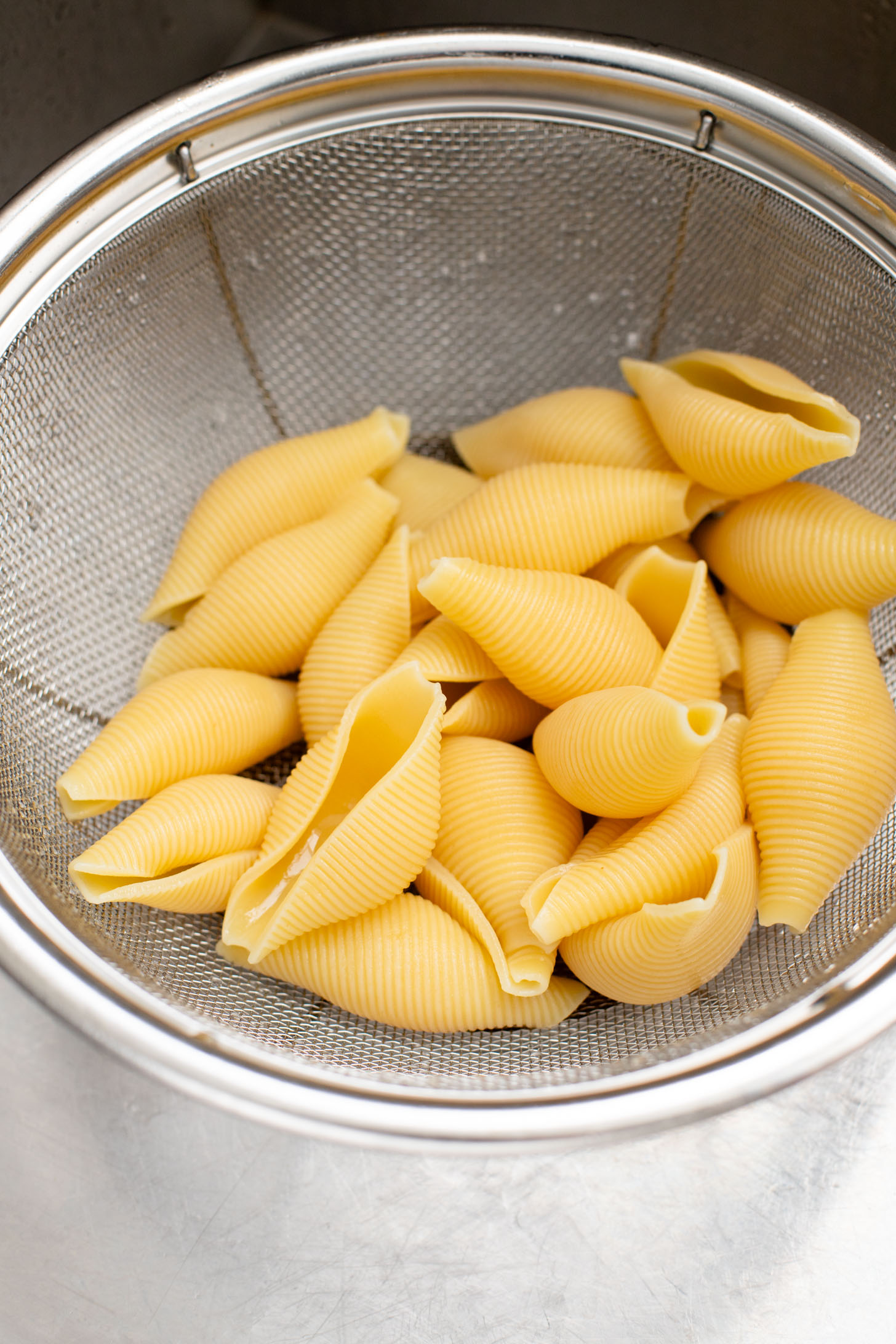 These Delicious Vegan Stuffed Shells are simple to make and even easier to eat. Filled with homemade tofu ricotta, spinach & basil in marinara | ThisSavoryVegan.com