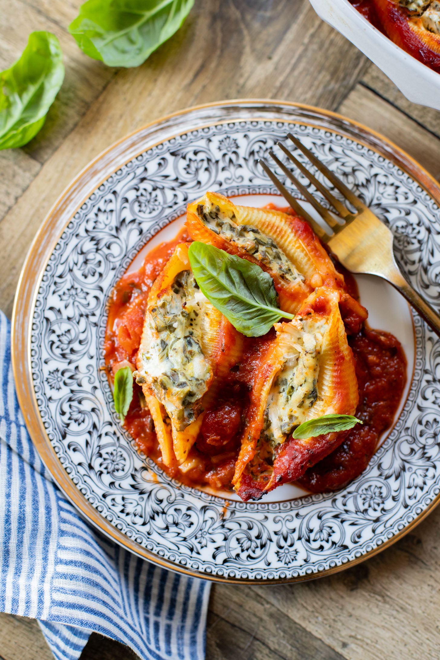 These Delicious Vegan Stuffed Shells are simple to make and even easier to eat. Filled with homemade tofu ricotta, spinach & basil in marinara | ThisSavoryVegan.com
