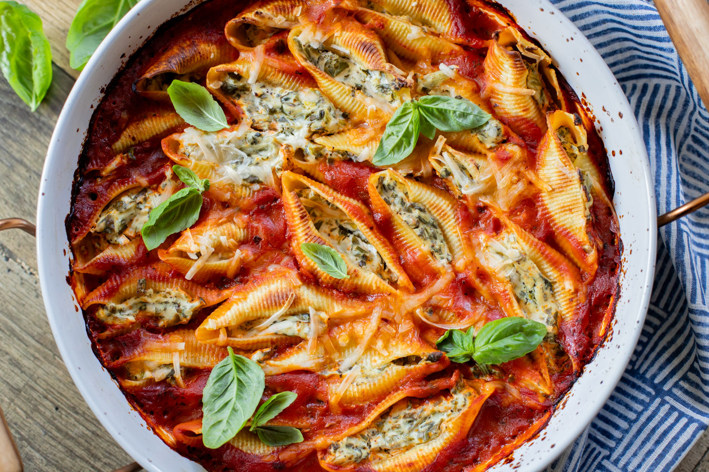 These Delicious Vegan Stuffed Shells are simple to make and even easier to eat. Filled with homemade tofu ricotta, spinach & basil in marinara | ThisSavoryVegan.com