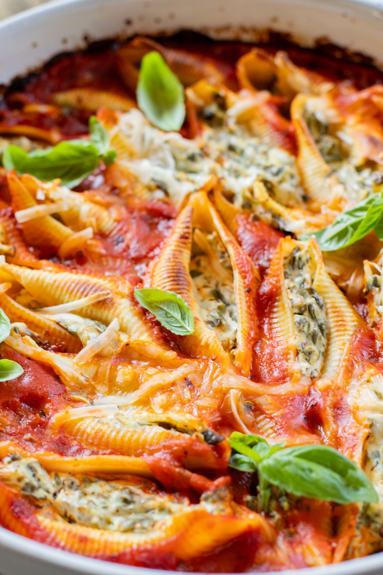 These Delicious Vegan Stuffed Shells are simple to make and even easier to eat. Filled with homemade tofu ricotta, spinach & basil in marinara | ThisSavoryVegan.com