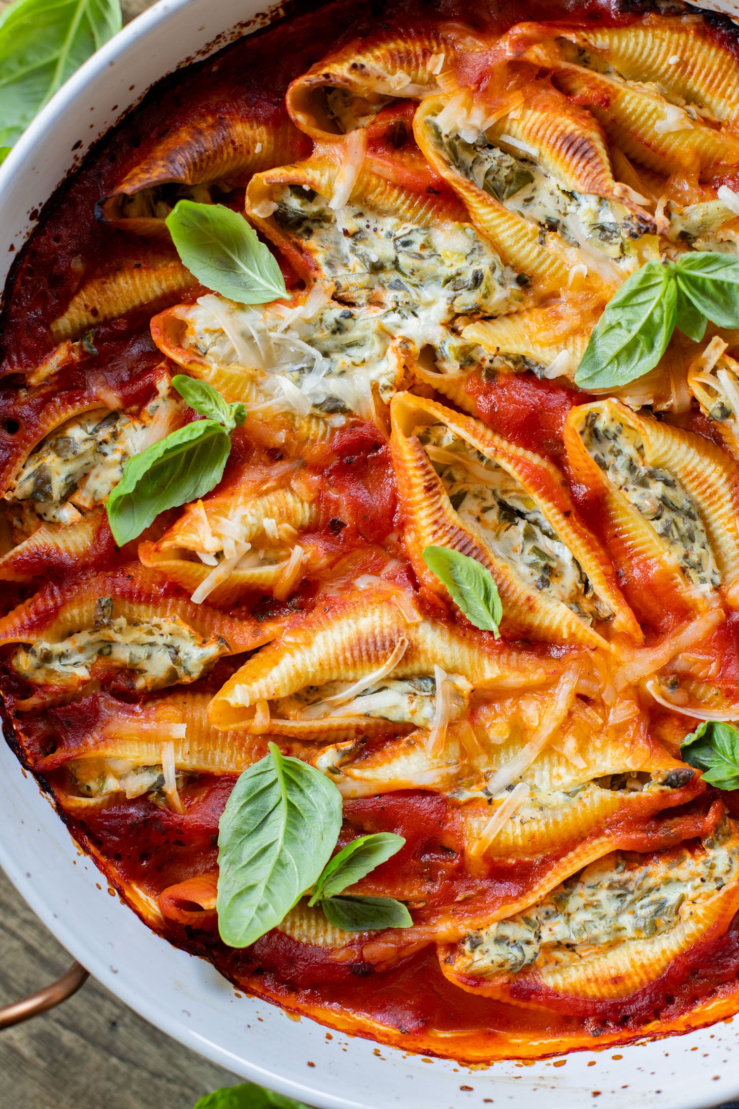 These Delicious Vegan Stuffed Shells are simple to make and even easier to eat. Filled with homemade tofu ricotta, spinach & basil in marinara | ThisSavoryVegan.com