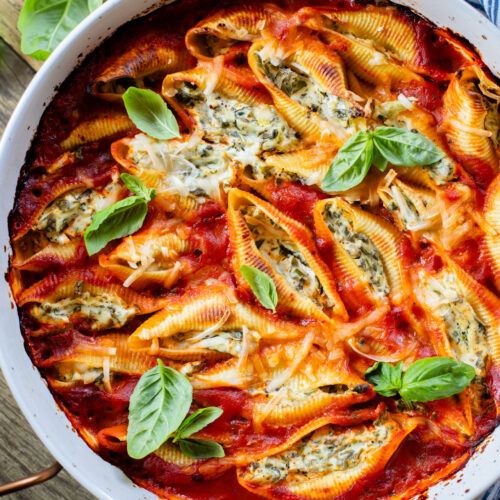 These Delicious Vegan Stuffed Shells are simple to make and even easier to eat. Filled with homemade tofu ricotta, spinach & basil in marinara | ThisSavoryVegan.com