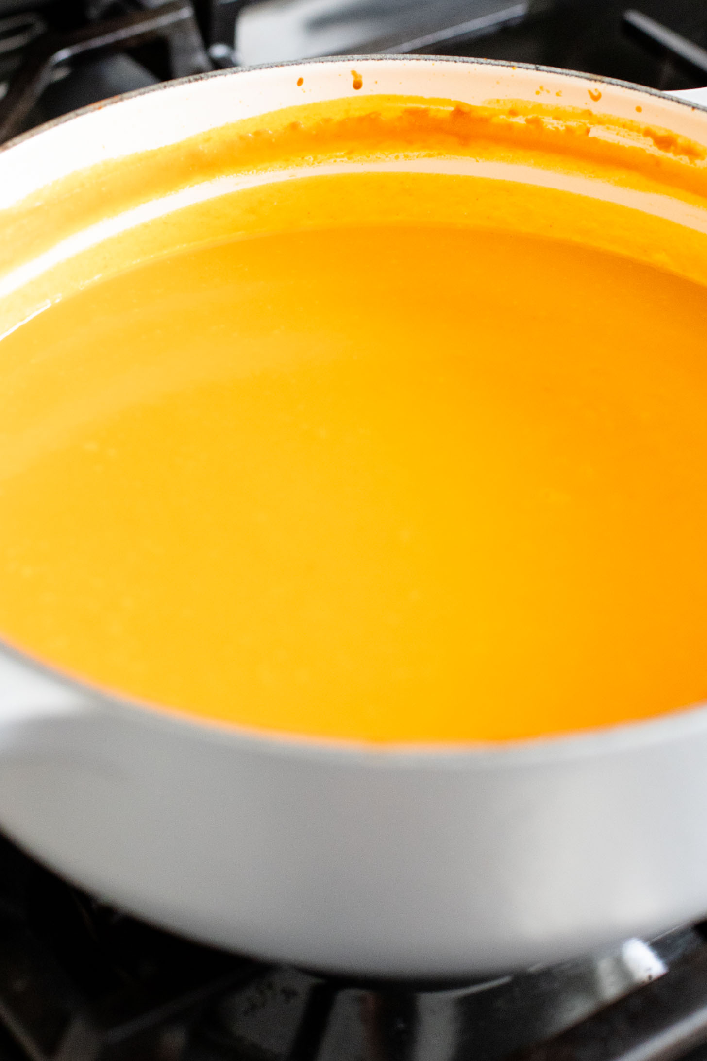 Creamy and comforting, this Thai Curry Pumpkin Soup is a dairy-free fall soup that everyone will love. Topped with crispy chickpeas | ThisSavoryVegan.com