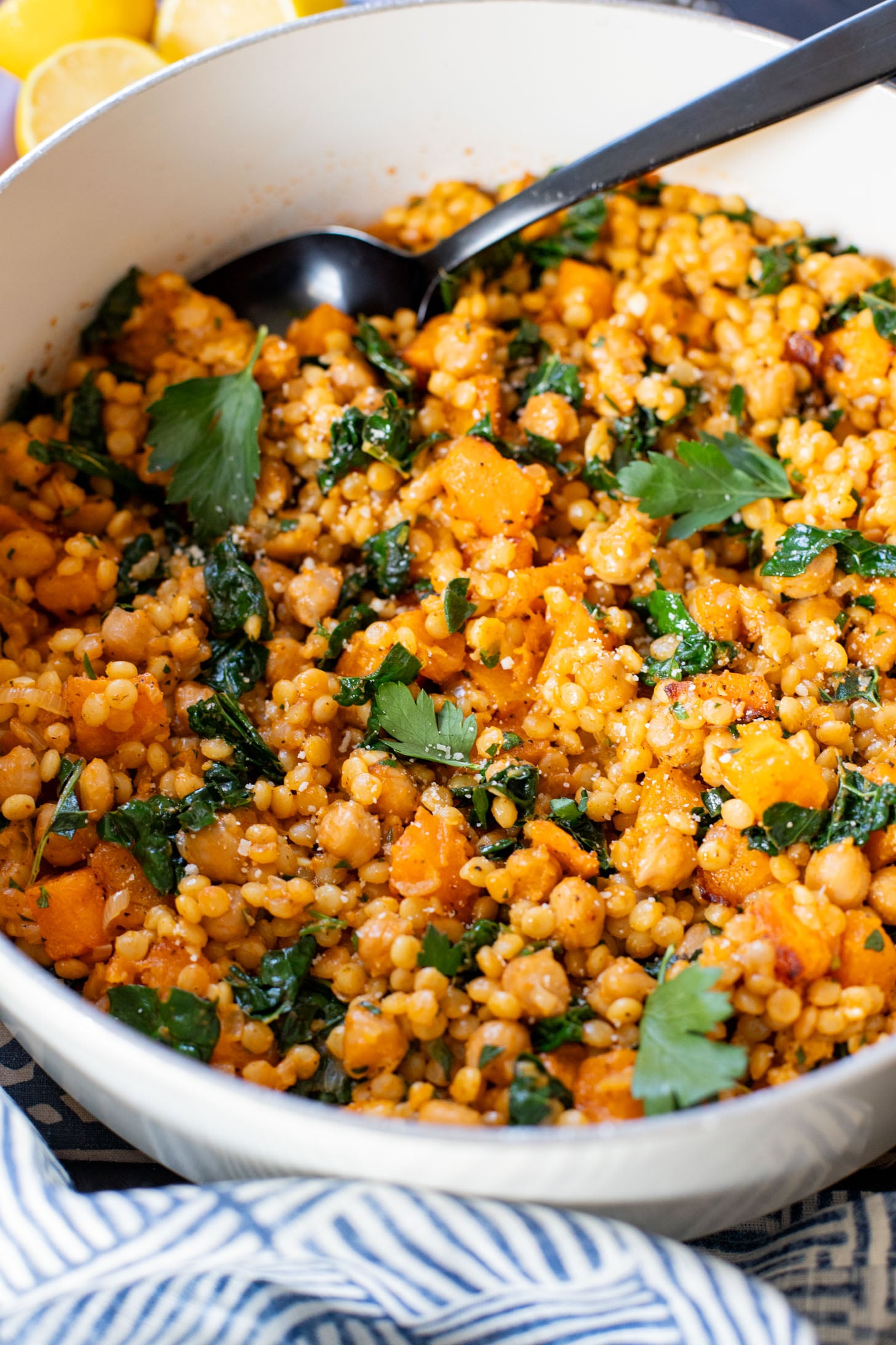This Fall Harvest Couscous Skillet is filled with roasted squash, chickpeas, kale and pearl couscous. Serve it hot or chilled | ThisSavoryVegan.com