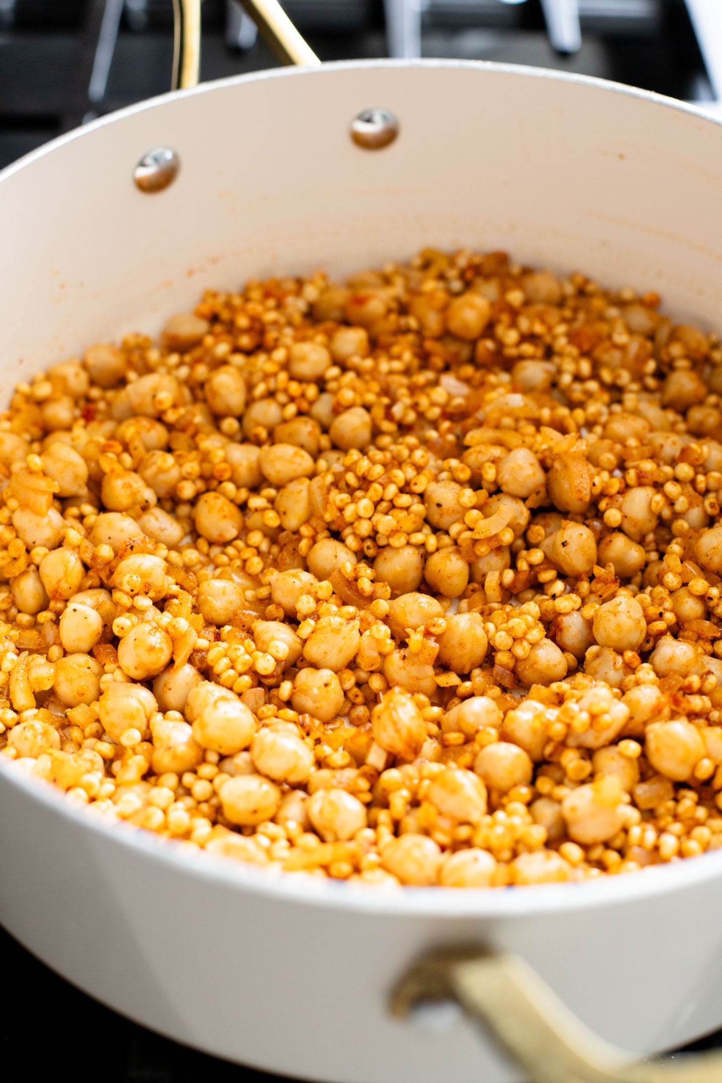 This Fall Harvest Couscous Skillet is filled with roasted squash, chickpeas, kale and pearl couscous. Serve it hot or chilled | ThisSavoryVegan.com
