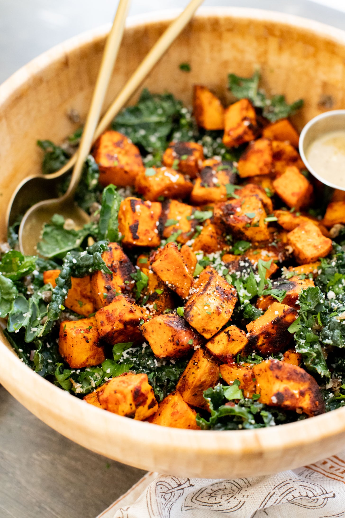 This Harissa Sweet Potato Kale Salad is layered with kale, lentils, vegan honey mustard dressing and crispy roasted sweet potatoes | ThisSavoryVegan.com
