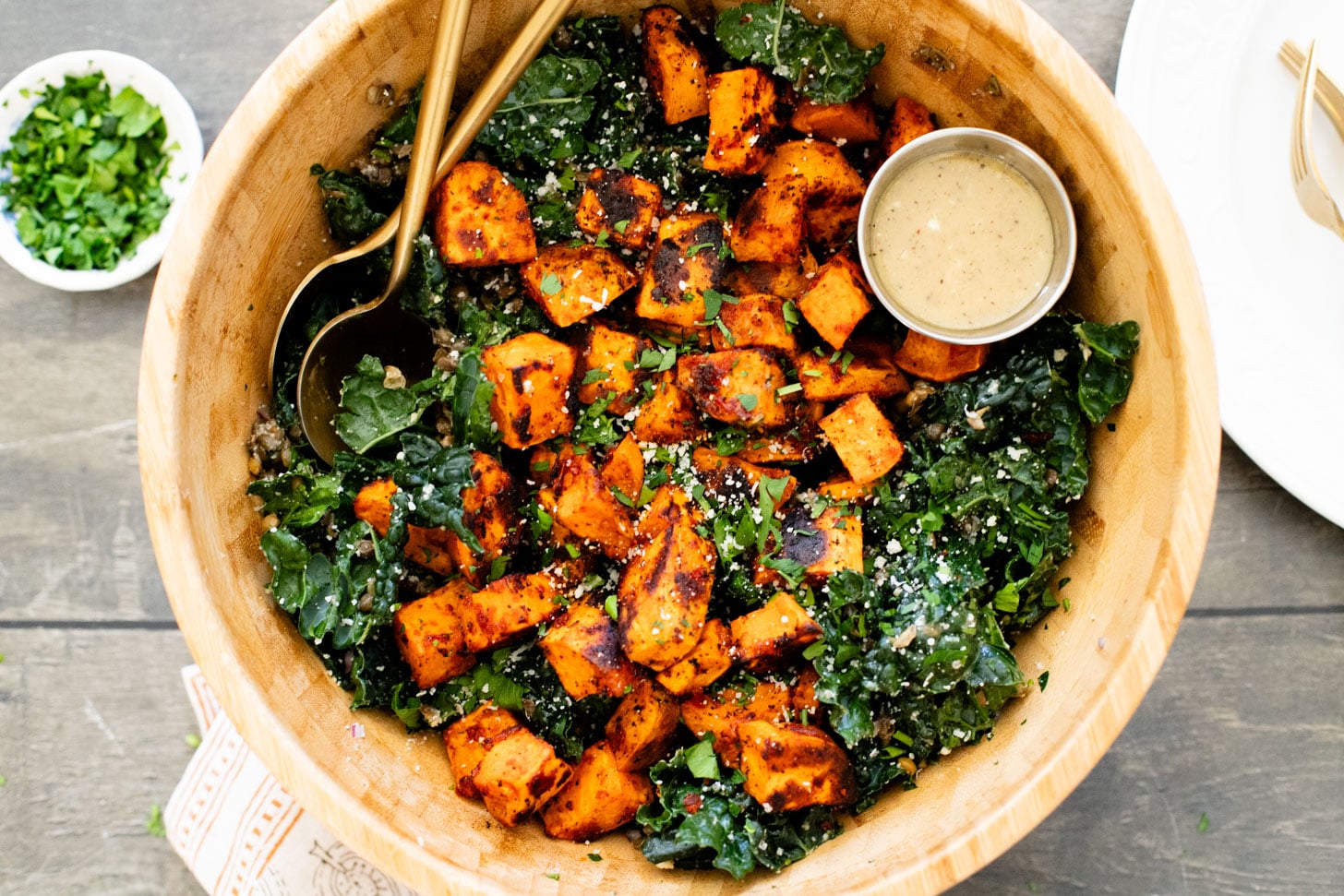 This Harissa Sweet Potato Kale Salad is layered with kale, lentils, vegan honey mustard dressing and crispy roasted sweet potatoes | ThisSavoryVegan.com