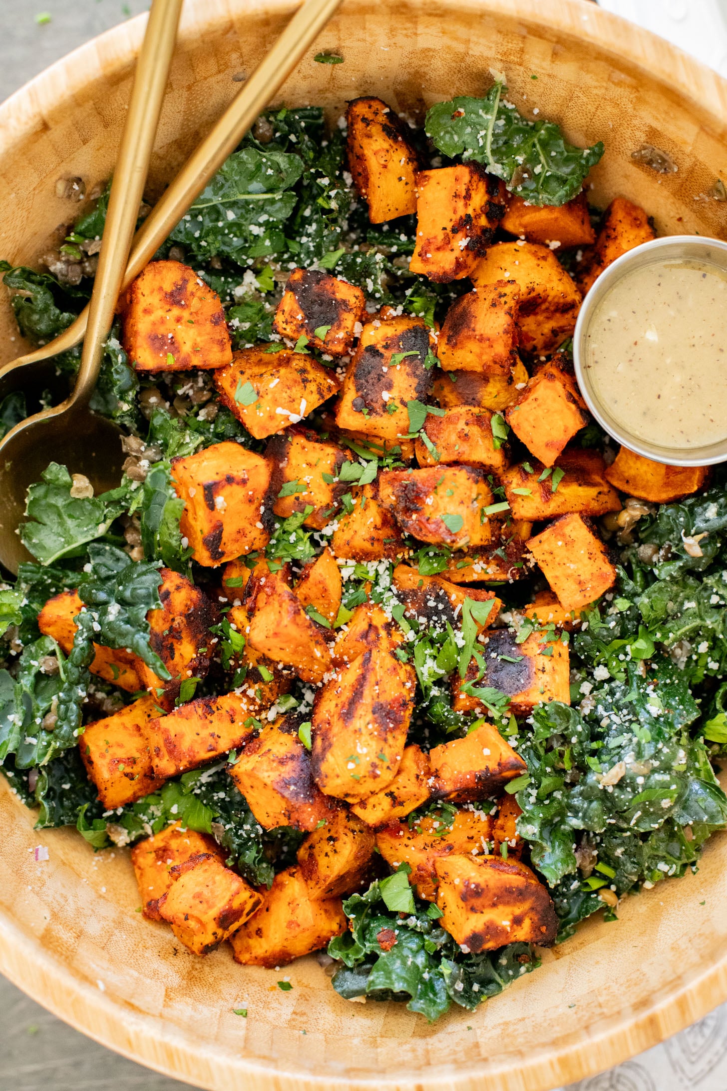 This Harissa Sweet Potato Kale Salad is layered with kale, lentils, vegan honey mustard dressing and crispy roasted sweet potatoes | ThisSavoryVegan.com