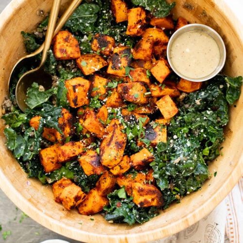 This Harissa Sweet Potato Kale Salad is layered with kale, lentils, vegan honey mustard dressing and crispy roasted sweet potatoes | ThisSavoryVegan.com