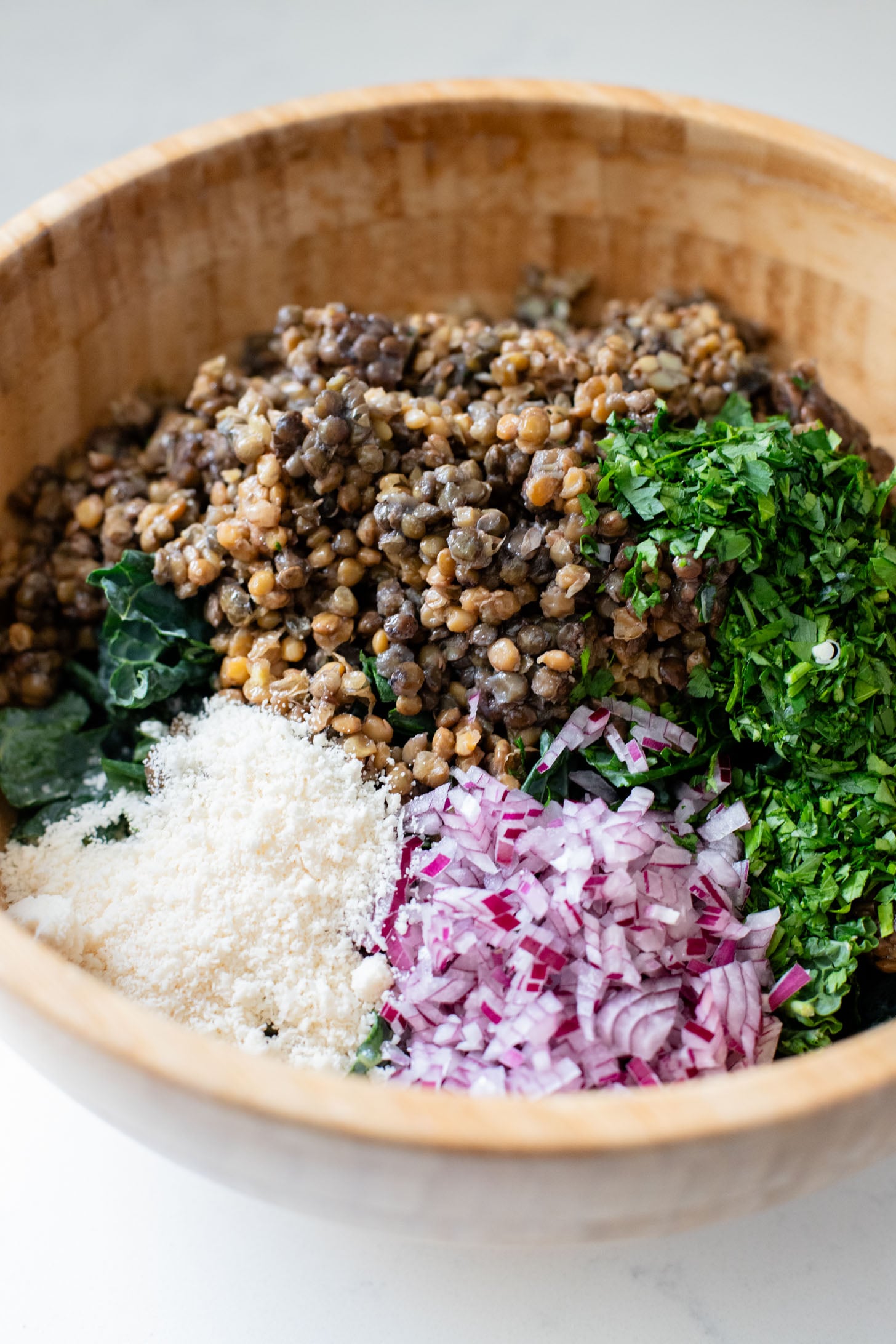 This Harissa Sweet Potato Kale Salad is layered with kale, lentils, vegan honey mustard dressing and crispy roasted sweet potatoes | ThisSavoryVegan.com