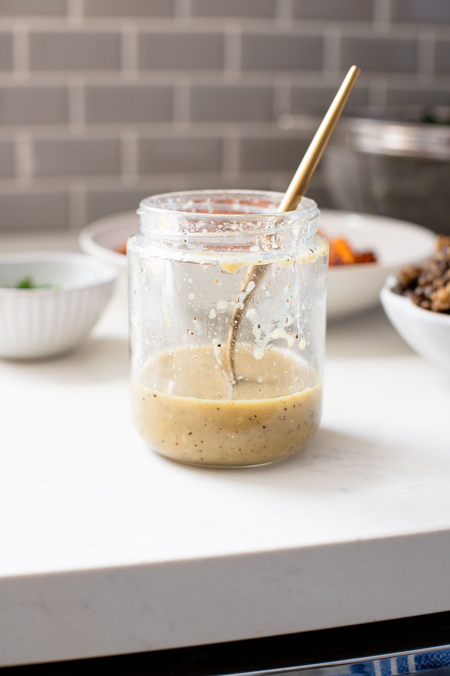 This Harissa Sweet Potato Kale Salad is layered with kale, lentils, vegan honey mustard dressing and crispy roasted sweet potatoes | ThisSavoryVegan.com