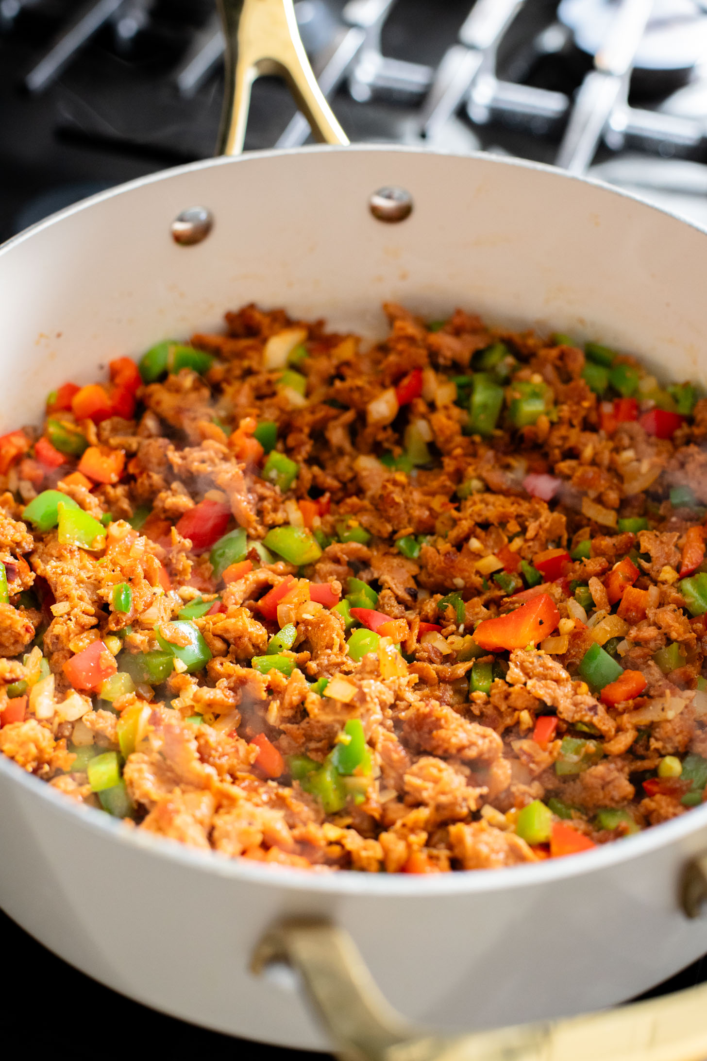 This Vegan Sausage Cauliflower Rice Skillet is the perfect high-protein vegan dinner! Everything is made in one pan for easy clean up | ThisSavoryVegan.com