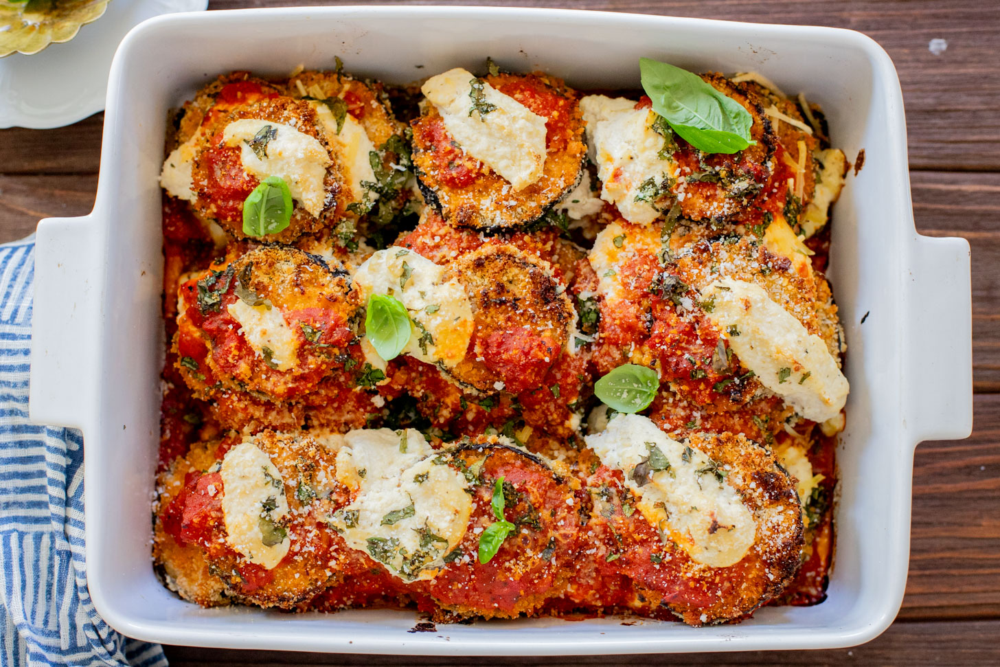 This Baked Eggplant Parmesan is dairy-free and has some sneaky protein in there. Serve with a salad for a low carb dinner or with a bowl of pasta | ThisSavoryVegan.com