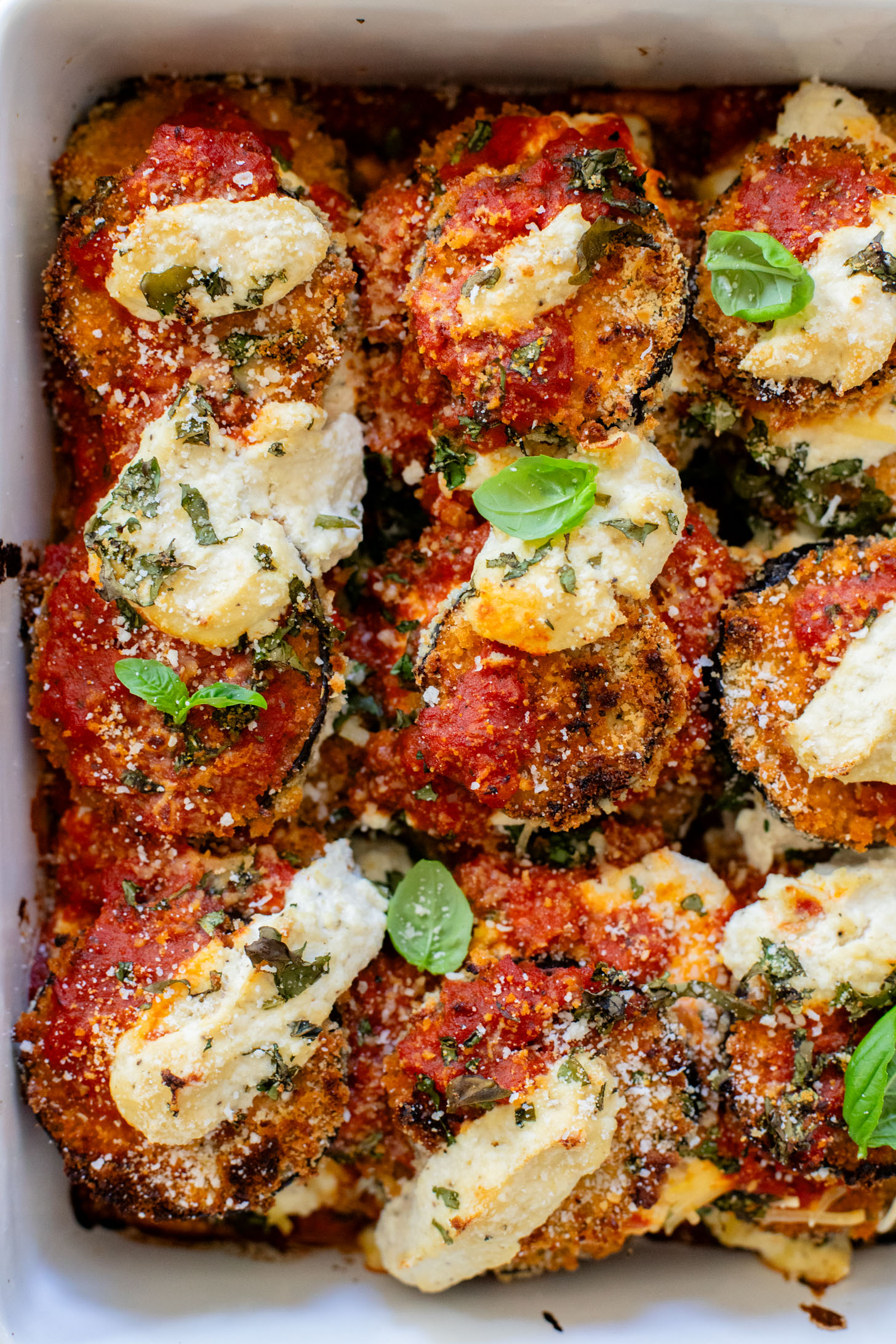 This Baked Eggplant Parmesan is dairy-free and has some sneaky protein in there. Serve with a salad for a low carb dinner or with a bowl of pasta | ThisSavoryVegan.com