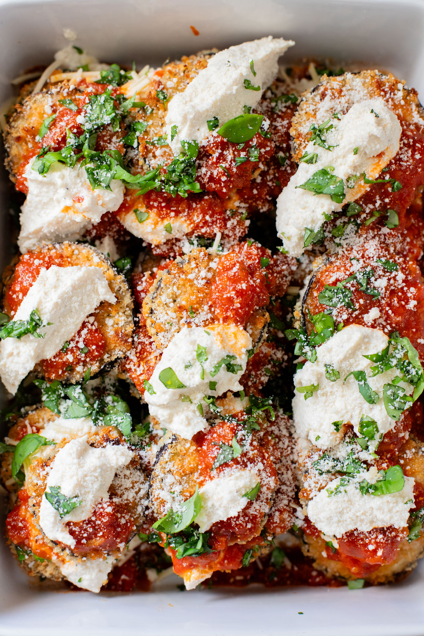 This Baked Eggplant Parmesan is dairy-free and has some sneaky protein in there. Serve with a salad for a low carb dinner or with a bowl of pasta | ThisSavoryVegan.com