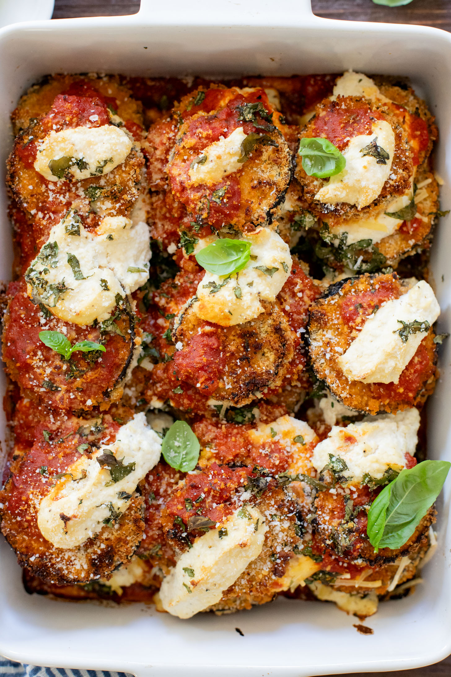 This Baked Eggplant Parmesan is dairy-free and has some sneaky protein in there. Serve with a salad for a low carb dinner or with a bowl of pasta | ThisSavoryVegan.com