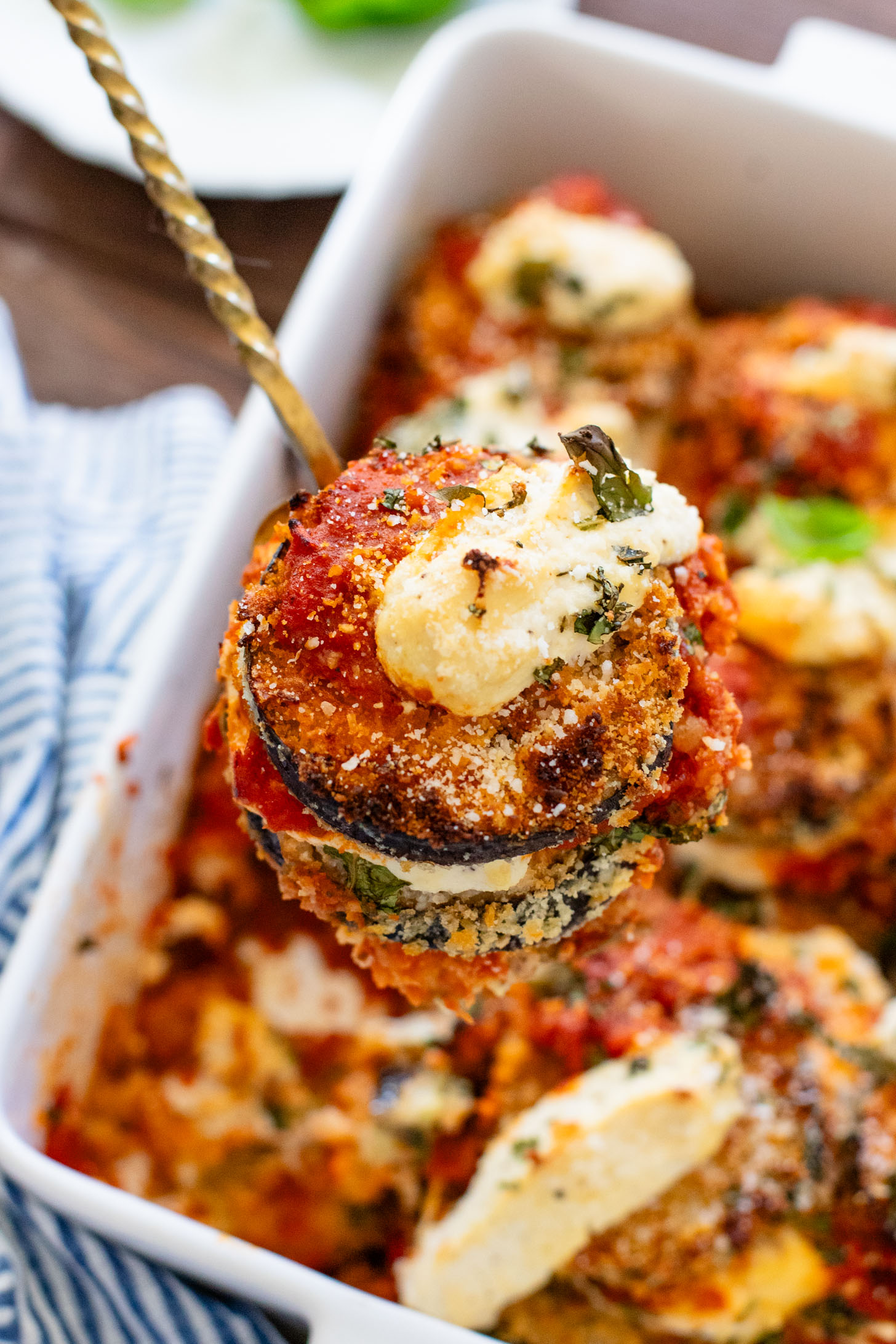 This Baked Eggplant Parmesan is dairy-free and has some sneaky protein in there. Serve with a salad for a low carb dinner or with a bowl of pasta | ThisSavoryVegan.com