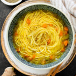 Perfect for a cold day, this Brothy Ginger Noodle Soup is simple and flavorful. A veggie broth base, with tender veggies and rice noodles | ThisSavoryVegan.com