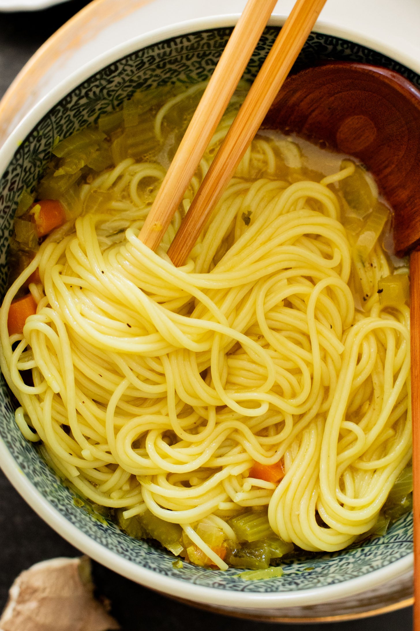 Perfect for a cold day, this Brothy Ginger Noodle Soup is simple and flavorful. A veggie broth base, with tender veggies and rice noodles | ThisSavoryVegan.com