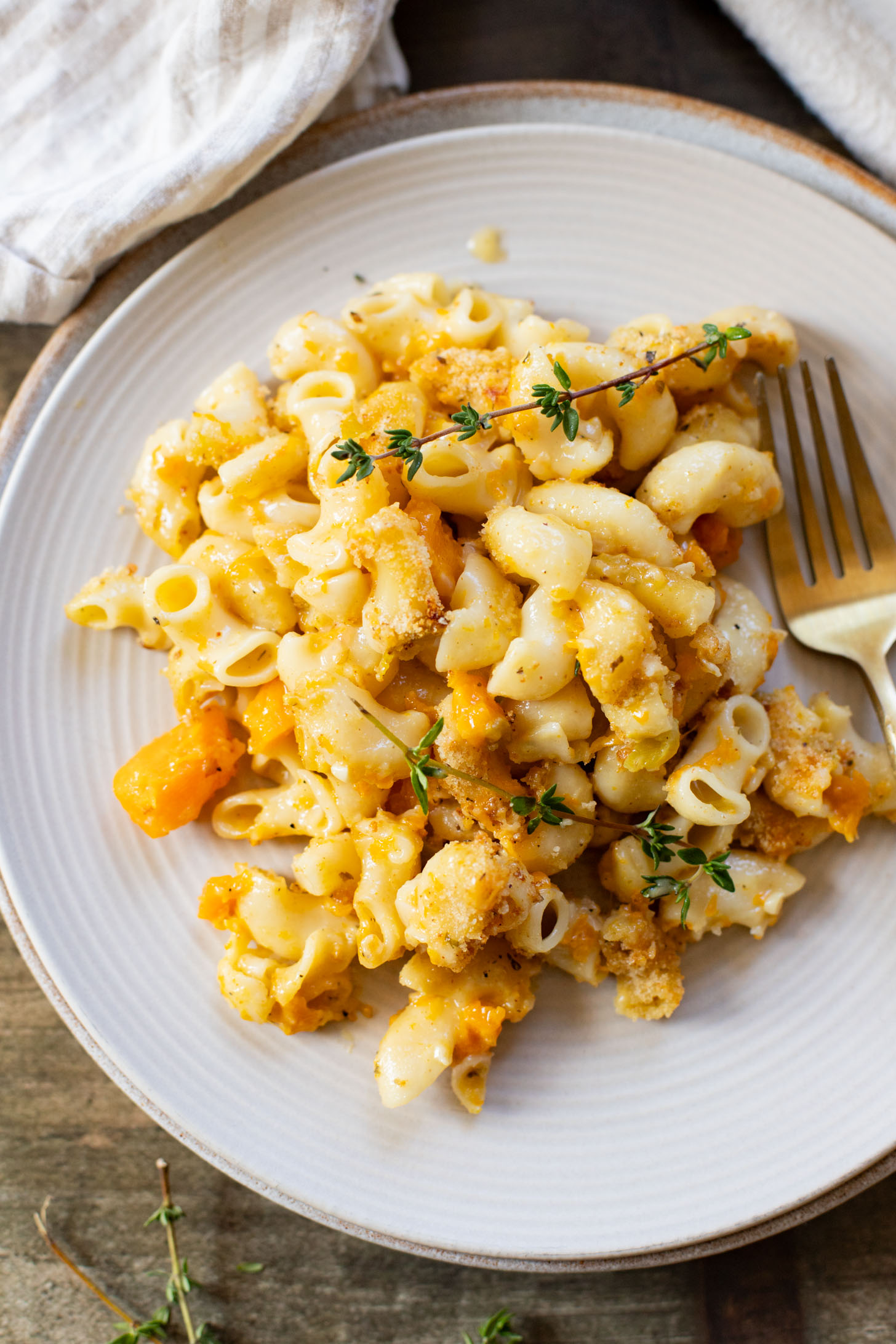 This Cheesy Butternut Squash Pasta Bake is the perfect vegan holiday casserole! Made with a dairy-free cheese sauce & tender squash pieces | ThisSavoryVegan.com